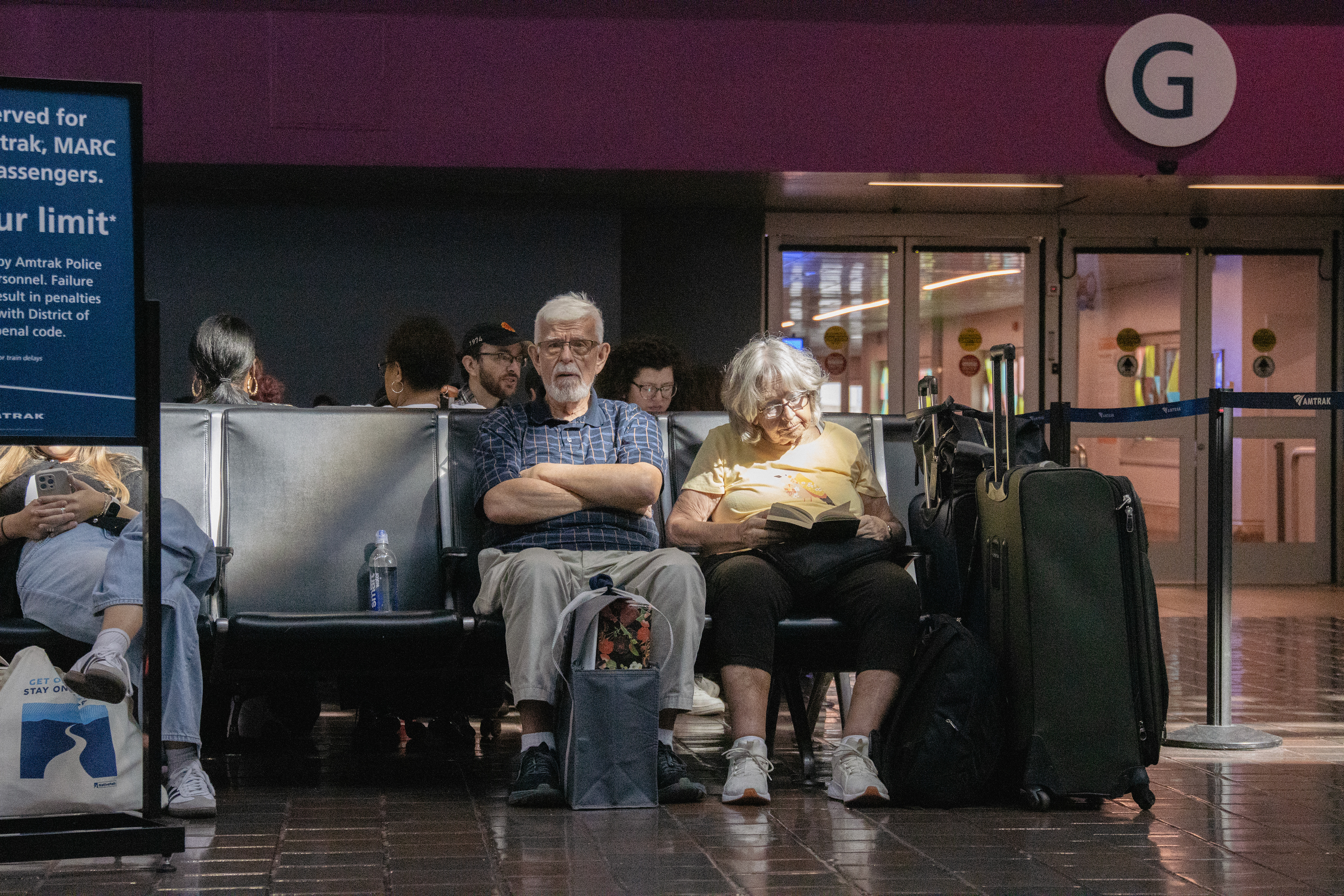 A man and woman sit inside of Union Station on Oct. 5, 2024. 