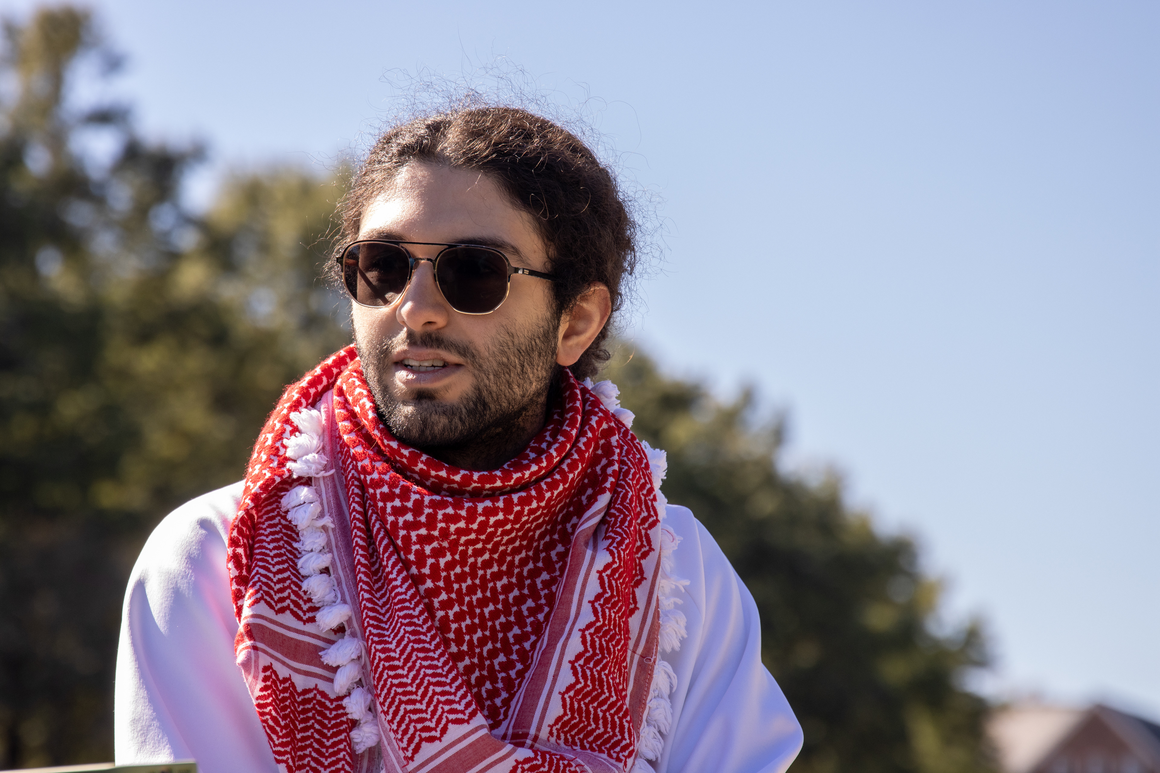 Fouad Ayoub, a senior mechanical engineering and computer science major, sits at the fountain on McKeldin Mall on Oct. 17, 2024. He reflects upon the war in Gaza.
