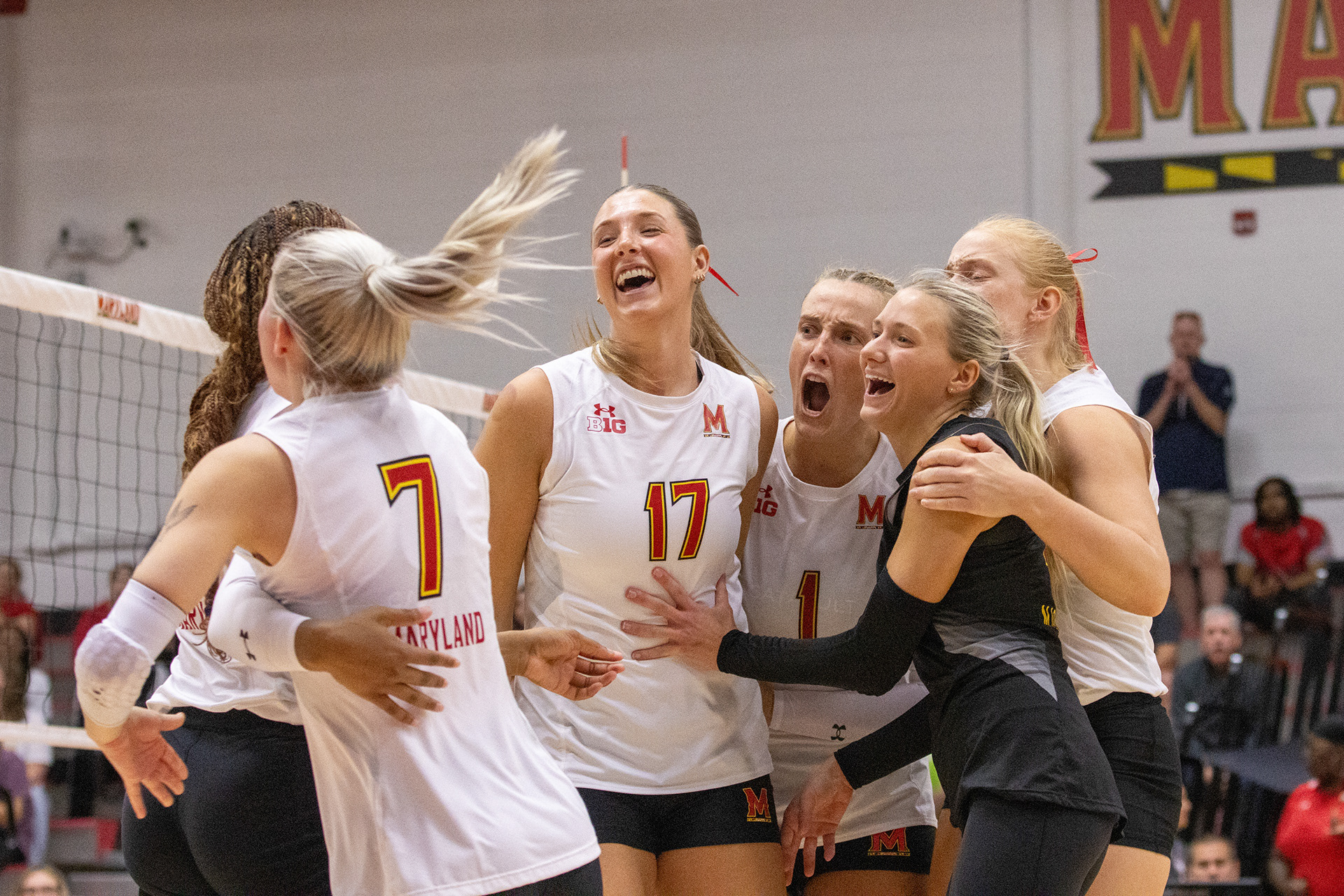 The Maryland women's volleyball team celebrate a point during their 3-2 loss to Iowa on Sept. 28, 2024.