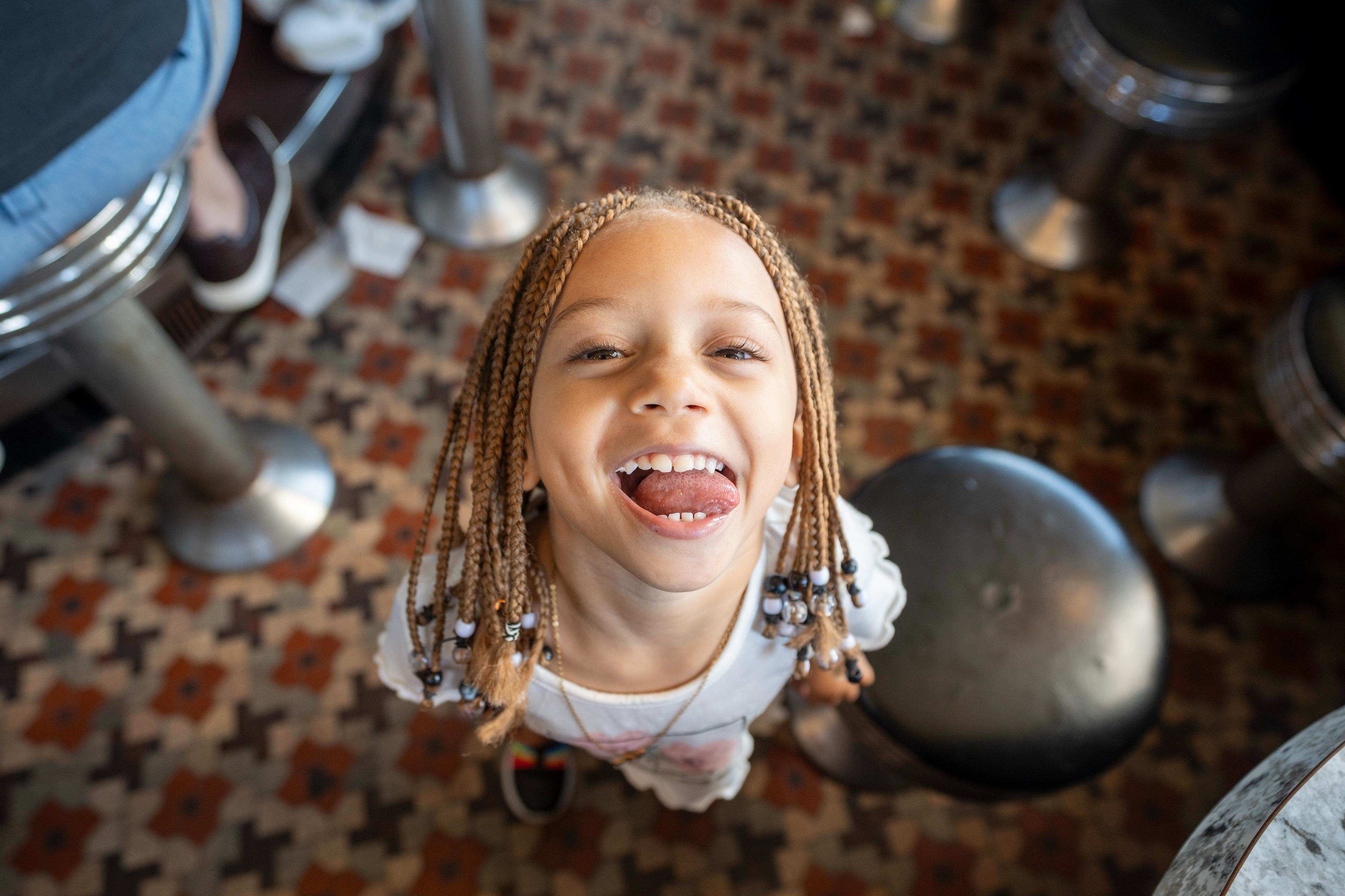 Anny Rodriguez sticks her tongue out while exploring the space at White Manna on June 29, 2026 in Hackensack, NJ, USA. The diner will move less than a  mile  down the road later this summer.