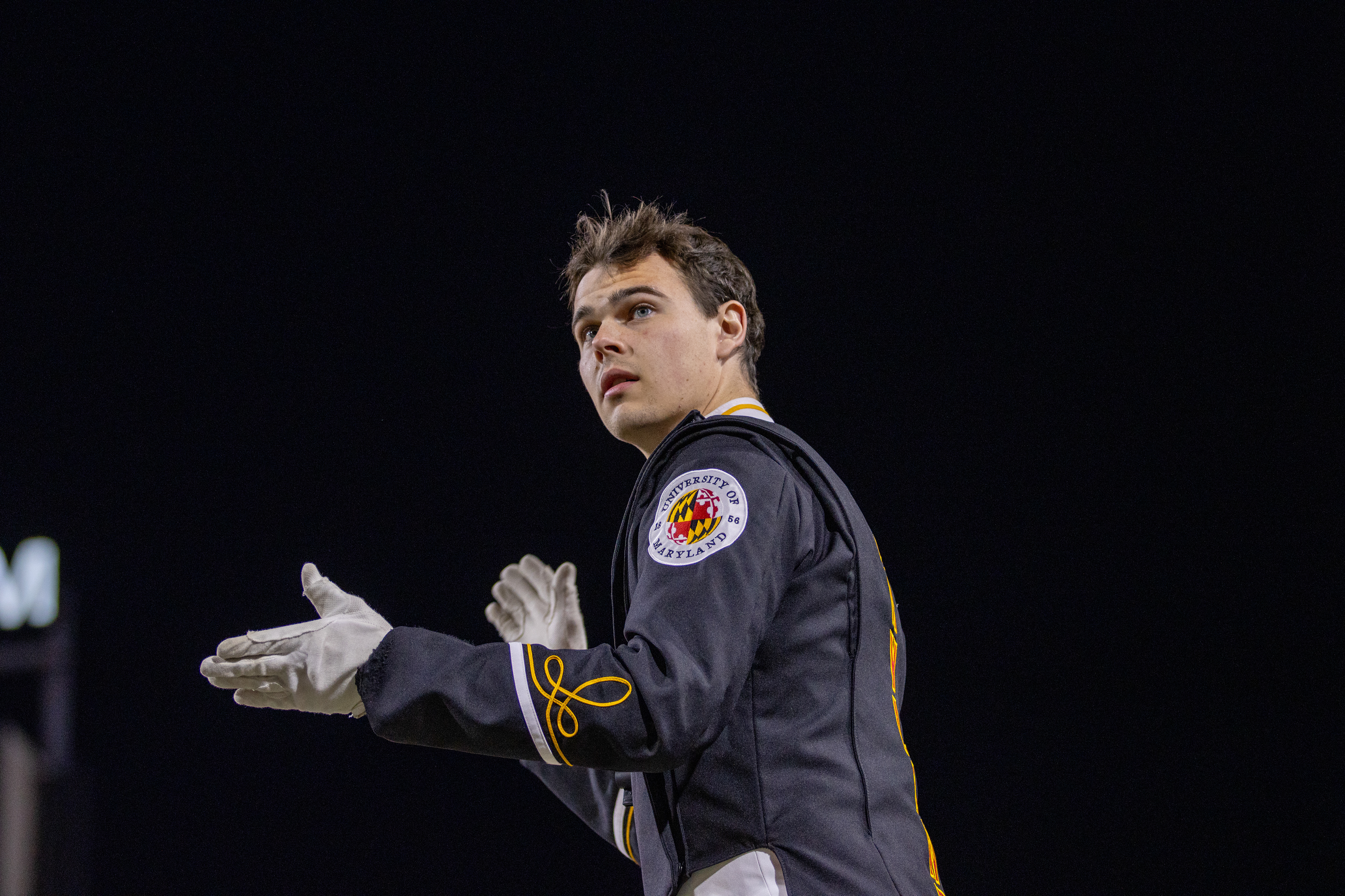 Colin Eng, one of the Mighty Sound of Maryland's drum majors, conducts the band during the halftime performance on Nov. 16, 2024. 
