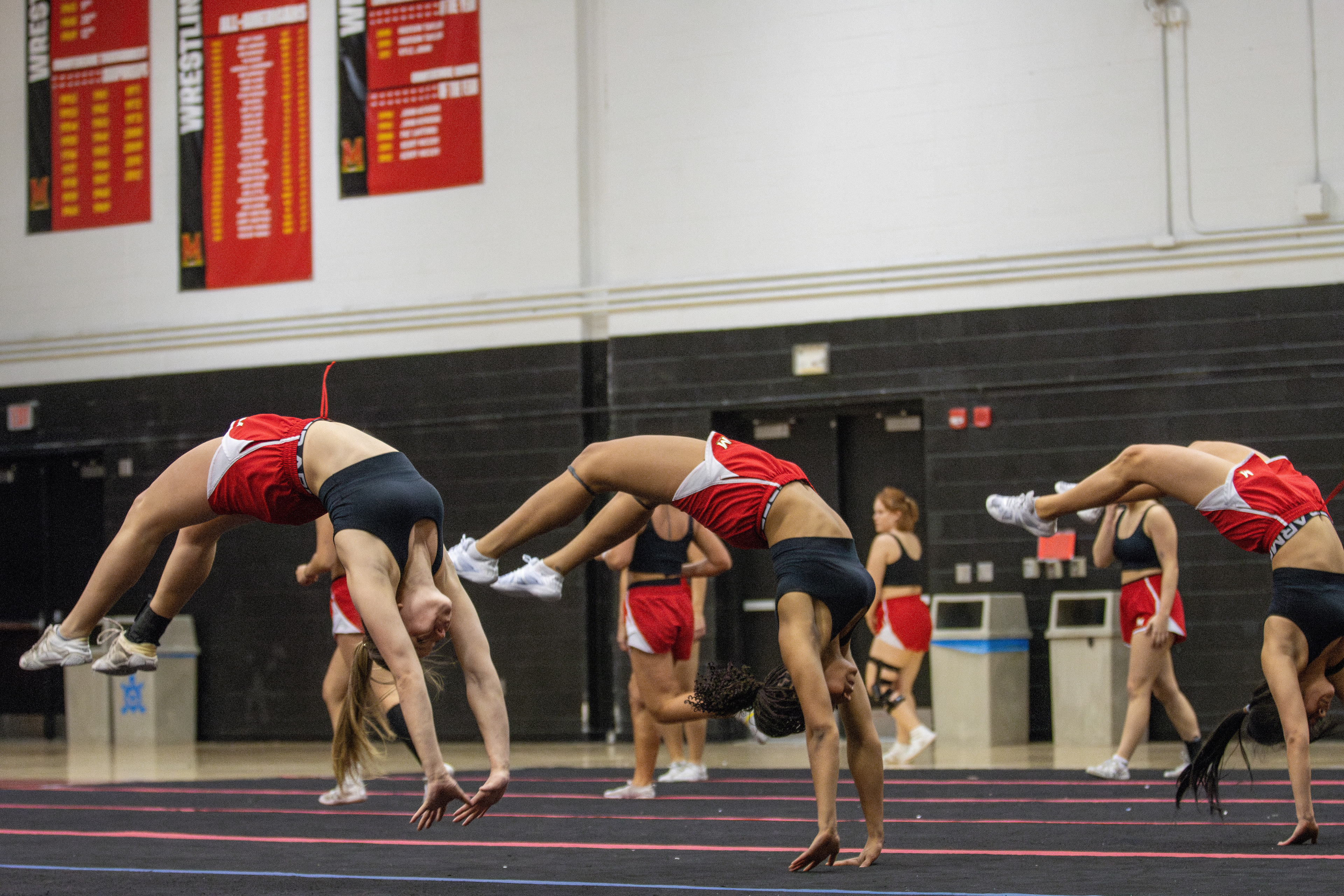 Maryland cheerleaders perform back handsprings during practice on Feb. 27, 2025.