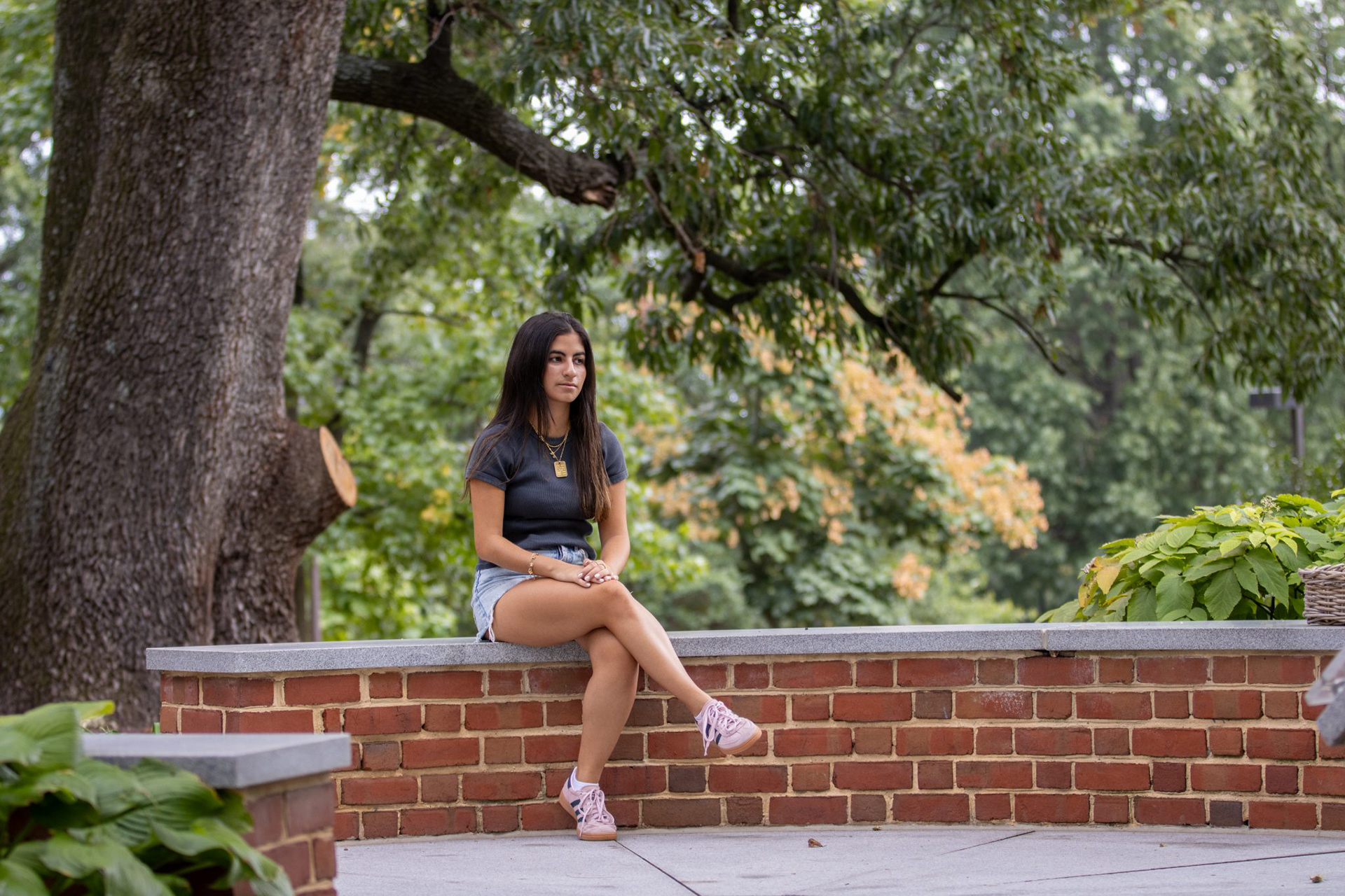 Ella Elimelech, a sophomore information science major, sits in the Chapel's Garden of Reflection and Remembrance as she reflects upon the recent killing of six hostages in Gaza.