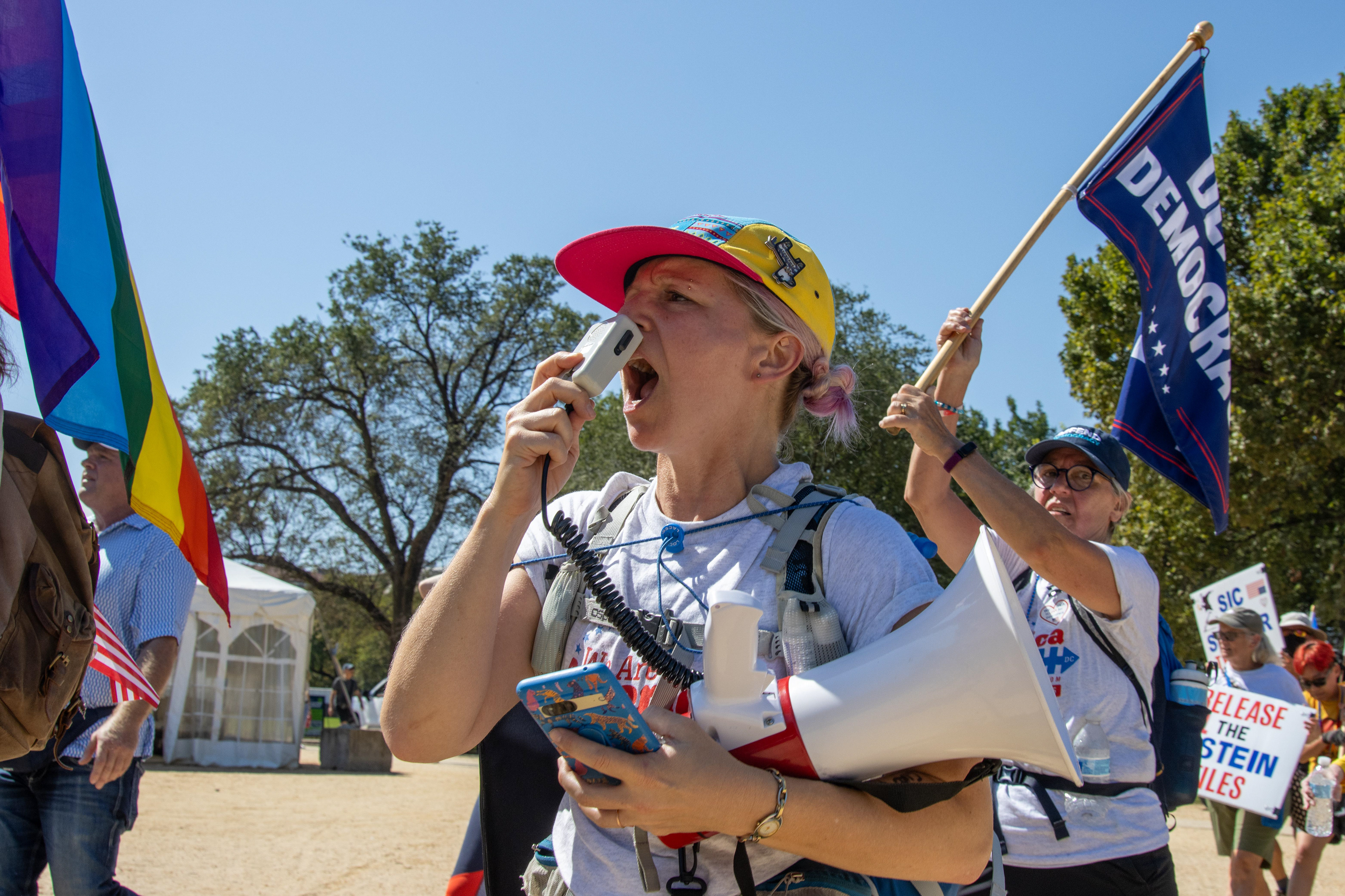 WASHINGTON - A demonstrator yells into a megaphone while walking along the National Mall on Sept. 19, 2025. Participants in the We Are America march walked from Independence Hall in Philadelphia, Pennsylvania to Washington, D.C. between Sept. 6 and Sept. 19 to "hold America accountable" and defend the U.S. Constitution.