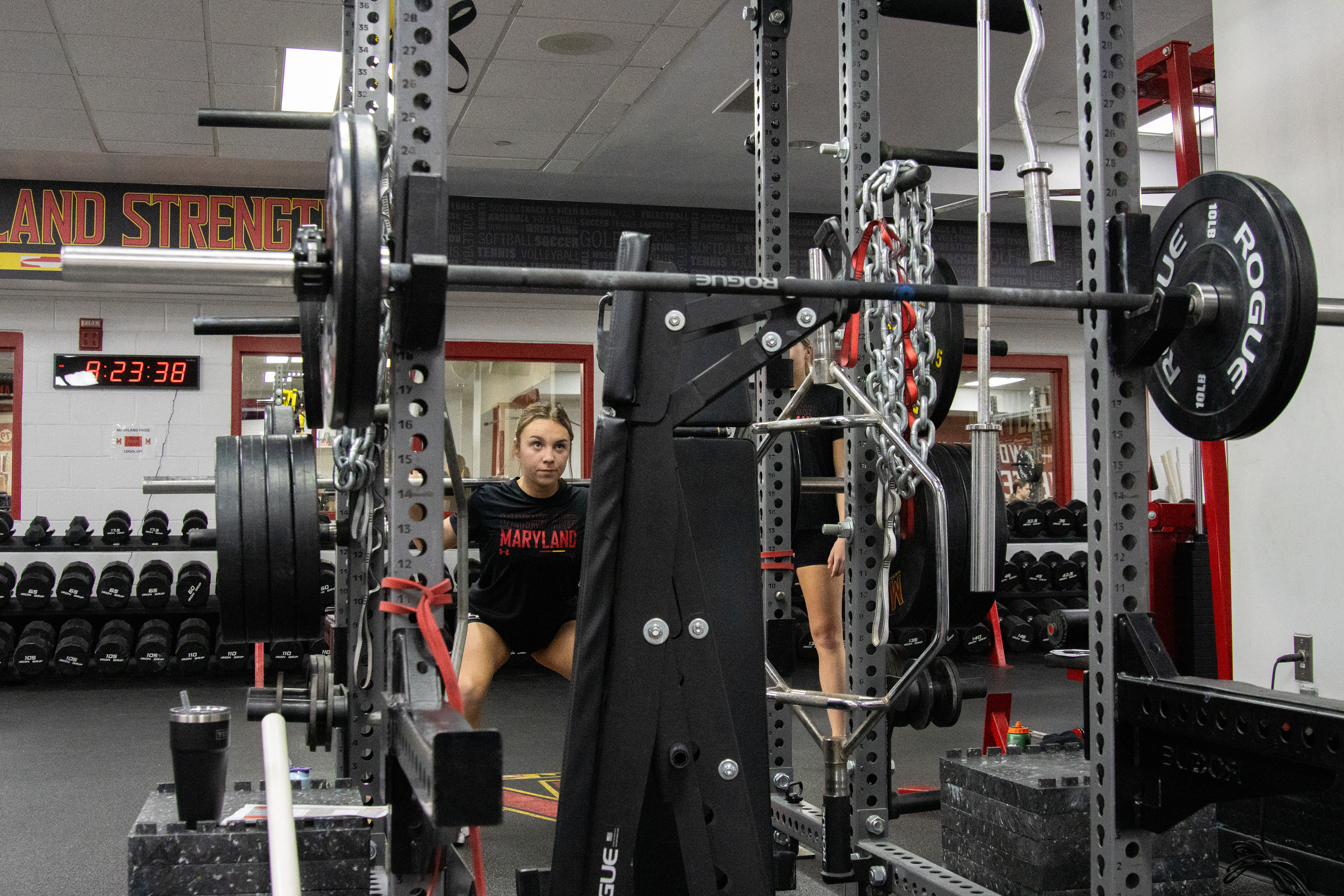 Junior Kalei Murray completes a barbell squat during one of Maryland cheer’s biweekly lift sessions inside Gossett Hall on March 4, 2025. 