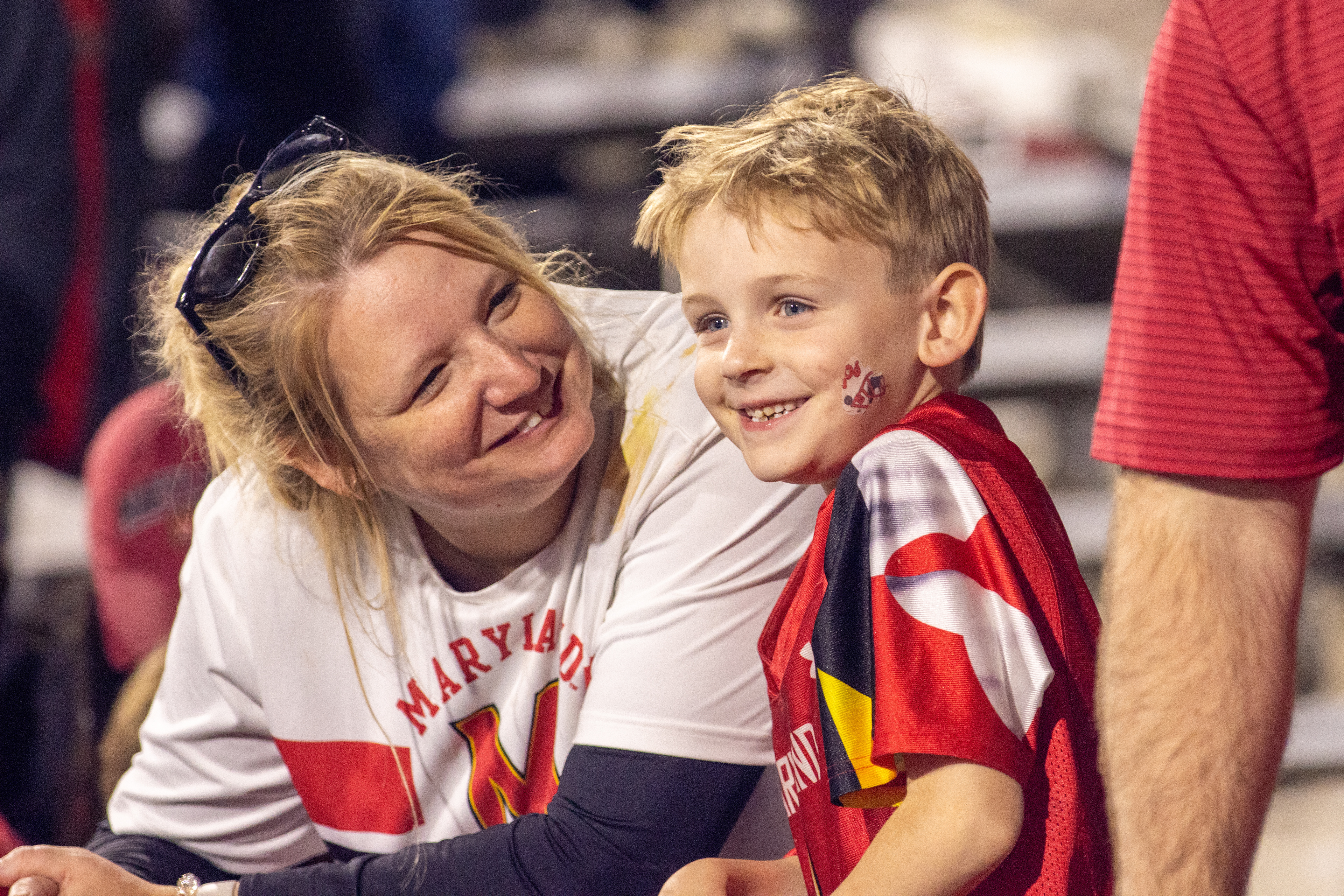 Two Maryland fans smile as Maryland football defeats USC 29-28 on Oct. 20, 2024.