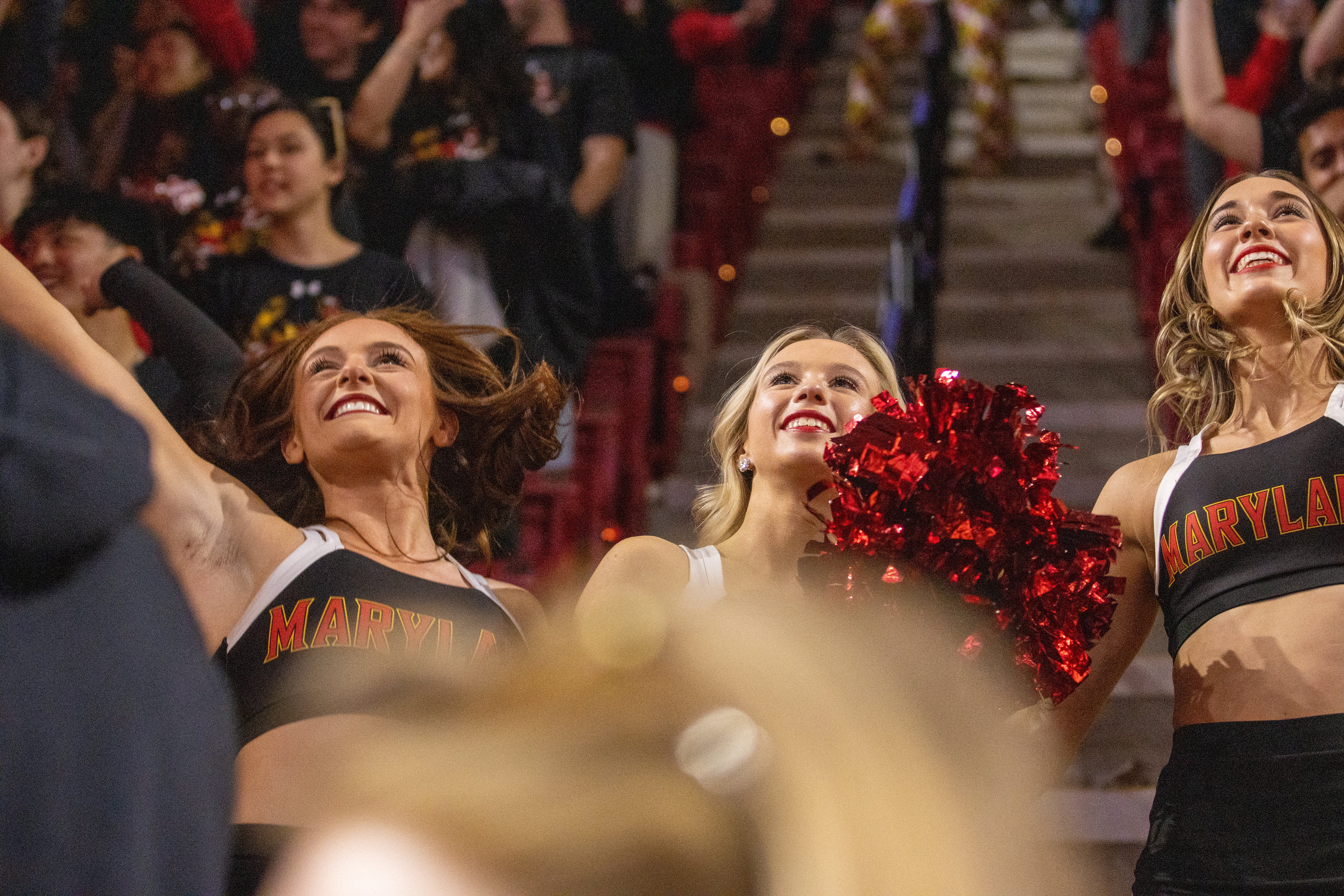 Senior cheerleaders cheer during the flag drop at Maryland's basketball game against Northwestern on March 8, 2025.