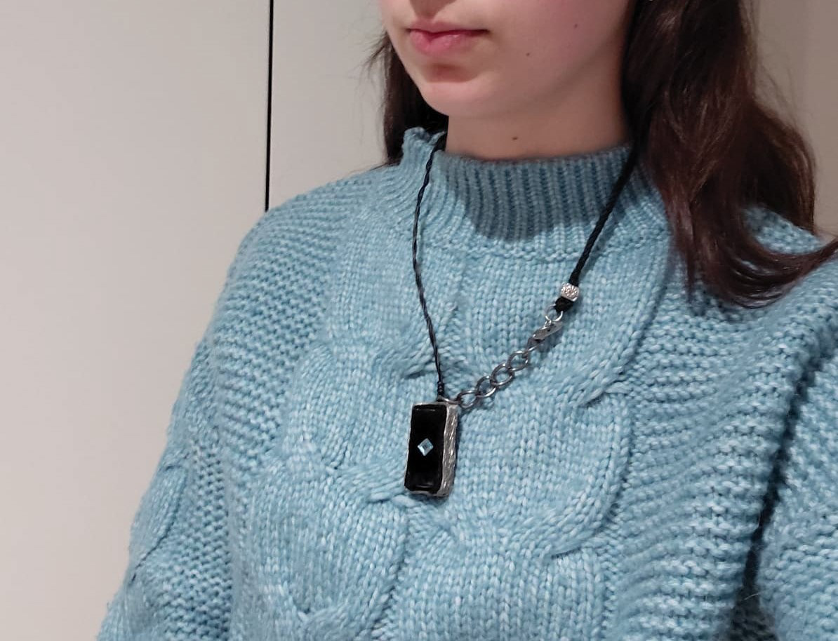 Wearing PosturePendant around the neck
