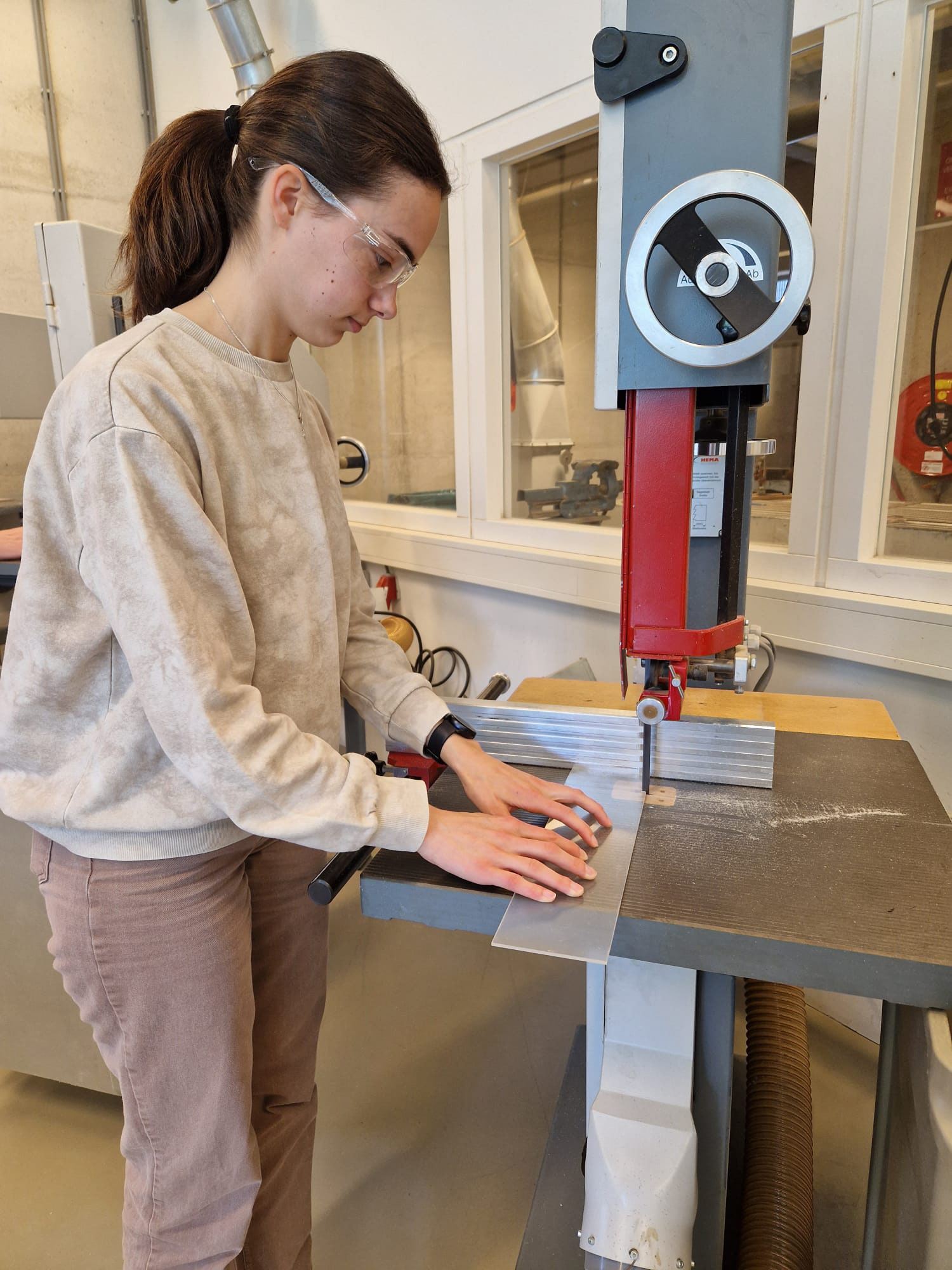 Working with plexiglass in the workshop during Project 1