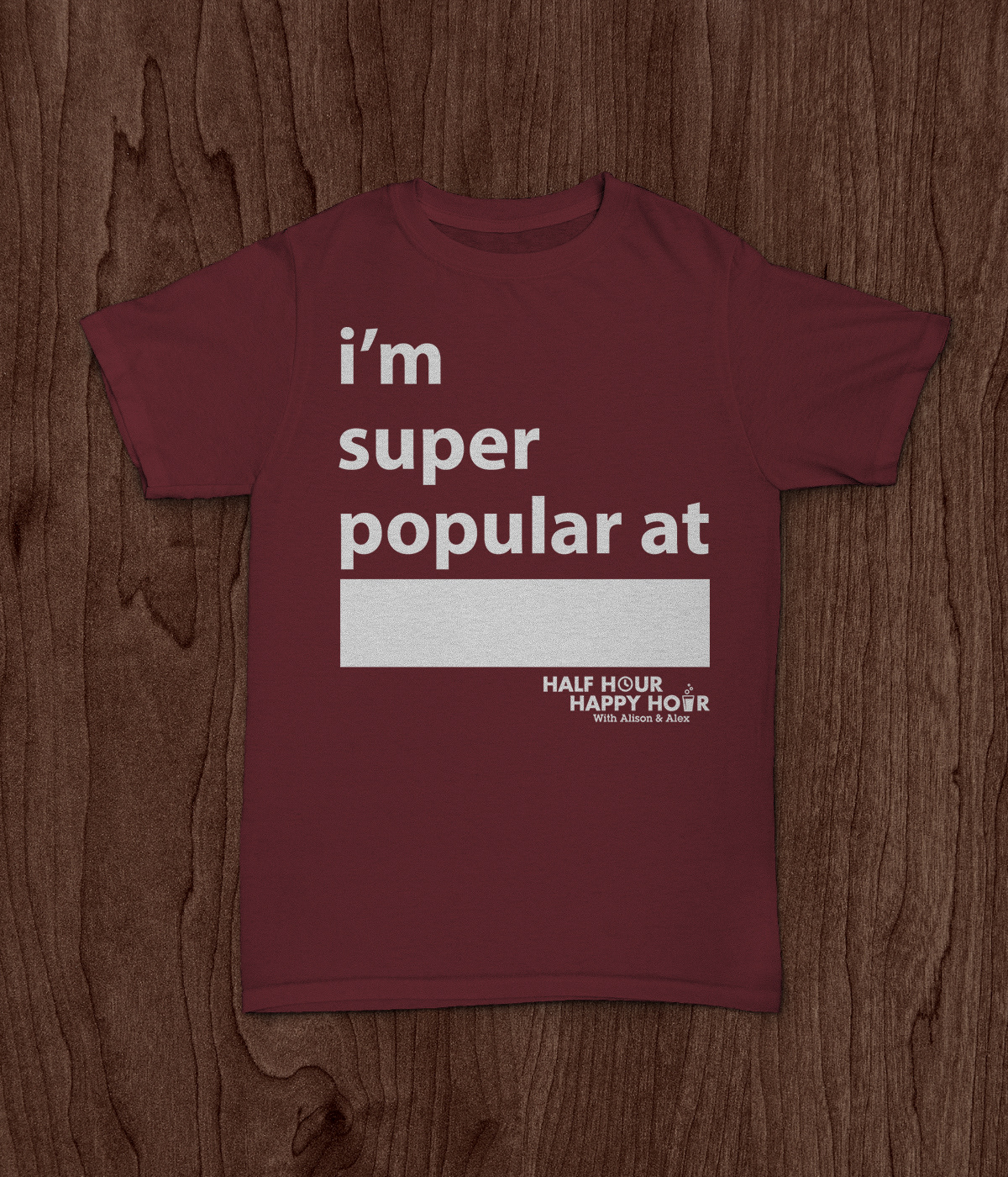 Photo of a t-shirt with a graphic design on it. The text reads "I'm super popular at blank" and the blank is there to fill in whatever the wearer wants.