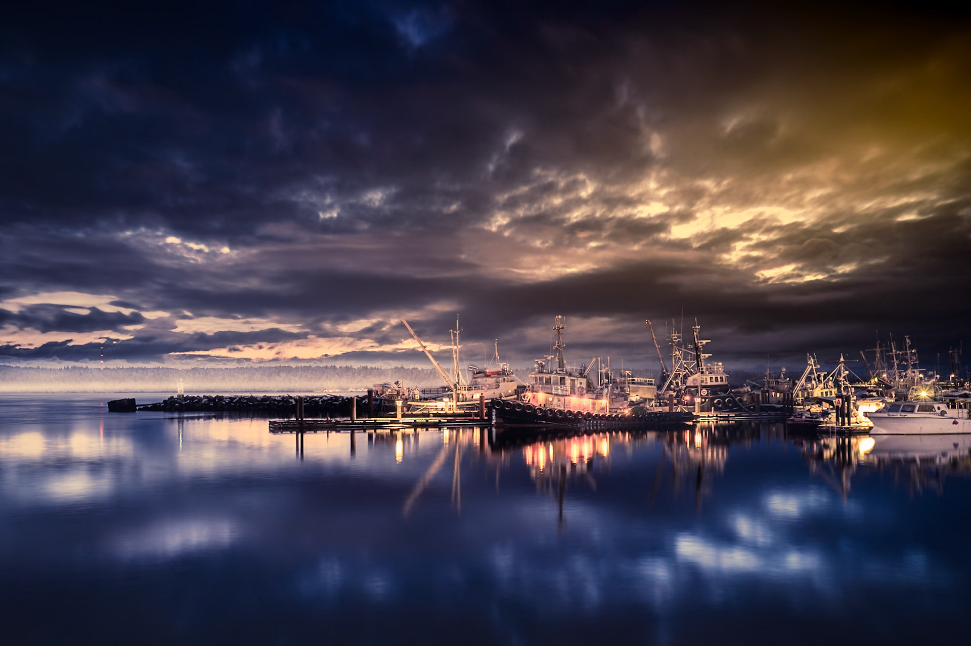 Pre-dawn photograph of the boats at Fishermen's Wharf in Campbell River with the surreal clouds, and pre-dawn colours making it an epic vision to experience.