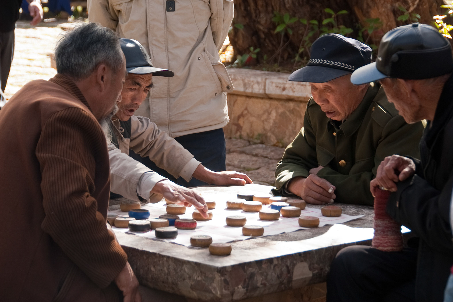 old men playing board game at Black Dragon Pool