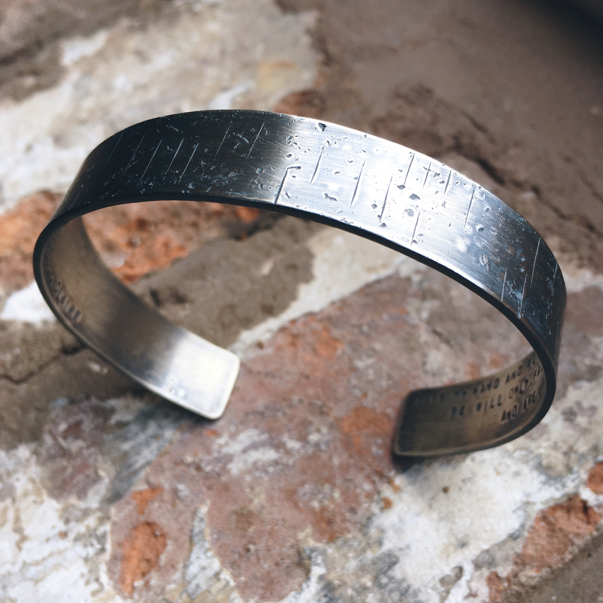Textured mens bangle with song lyrics inside