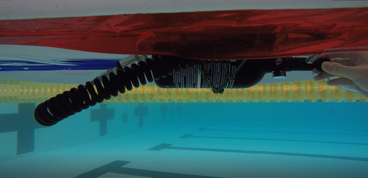 Deflated tubes allow for easy submersion and manipulation of the board under the patient