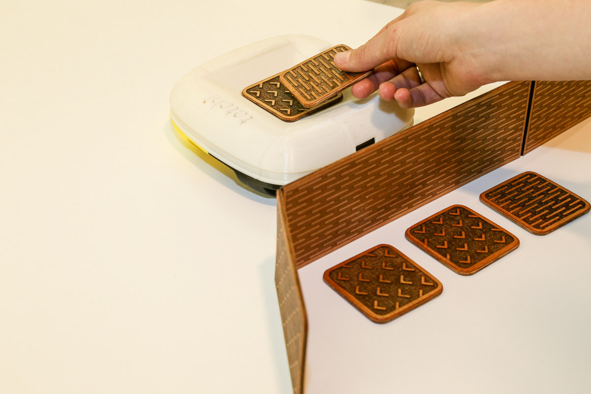 Each tile contains an RFID chip that stores its value. The centerpiece scans each tile and reads its value aloud