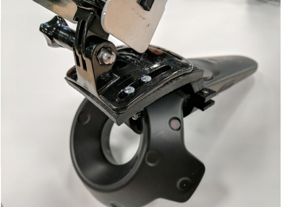 To attach an HTC Vive controller to the end effector, a GoPro hinge was fastened to a 3D printed coupler that was secured around the controller