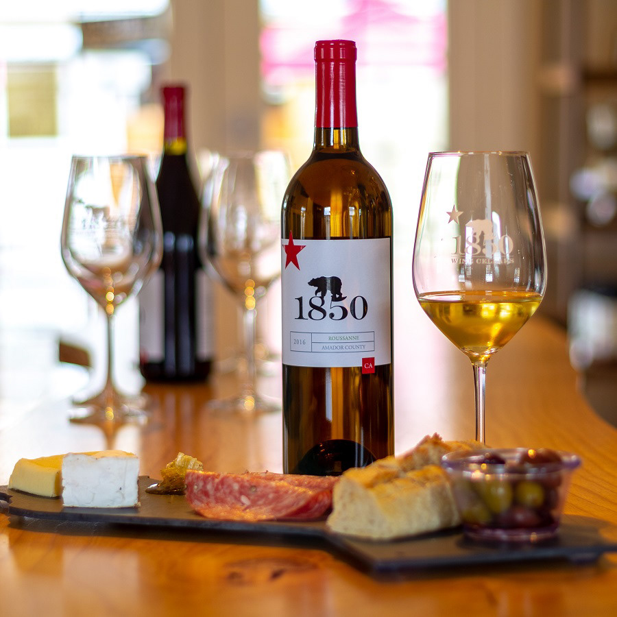 Bottle of wine with cheese plate