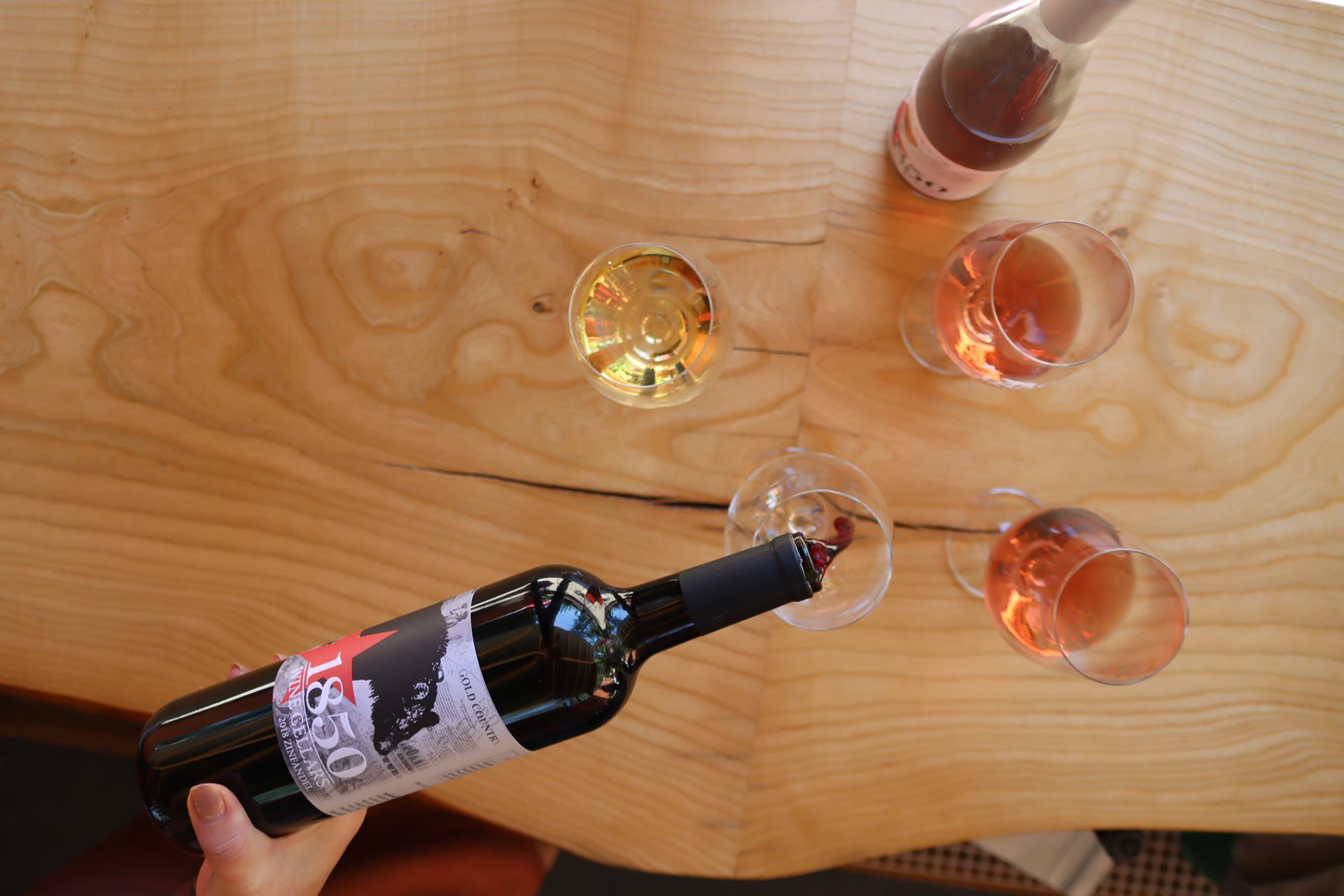 Bottle of Zinfandel being poured into glass