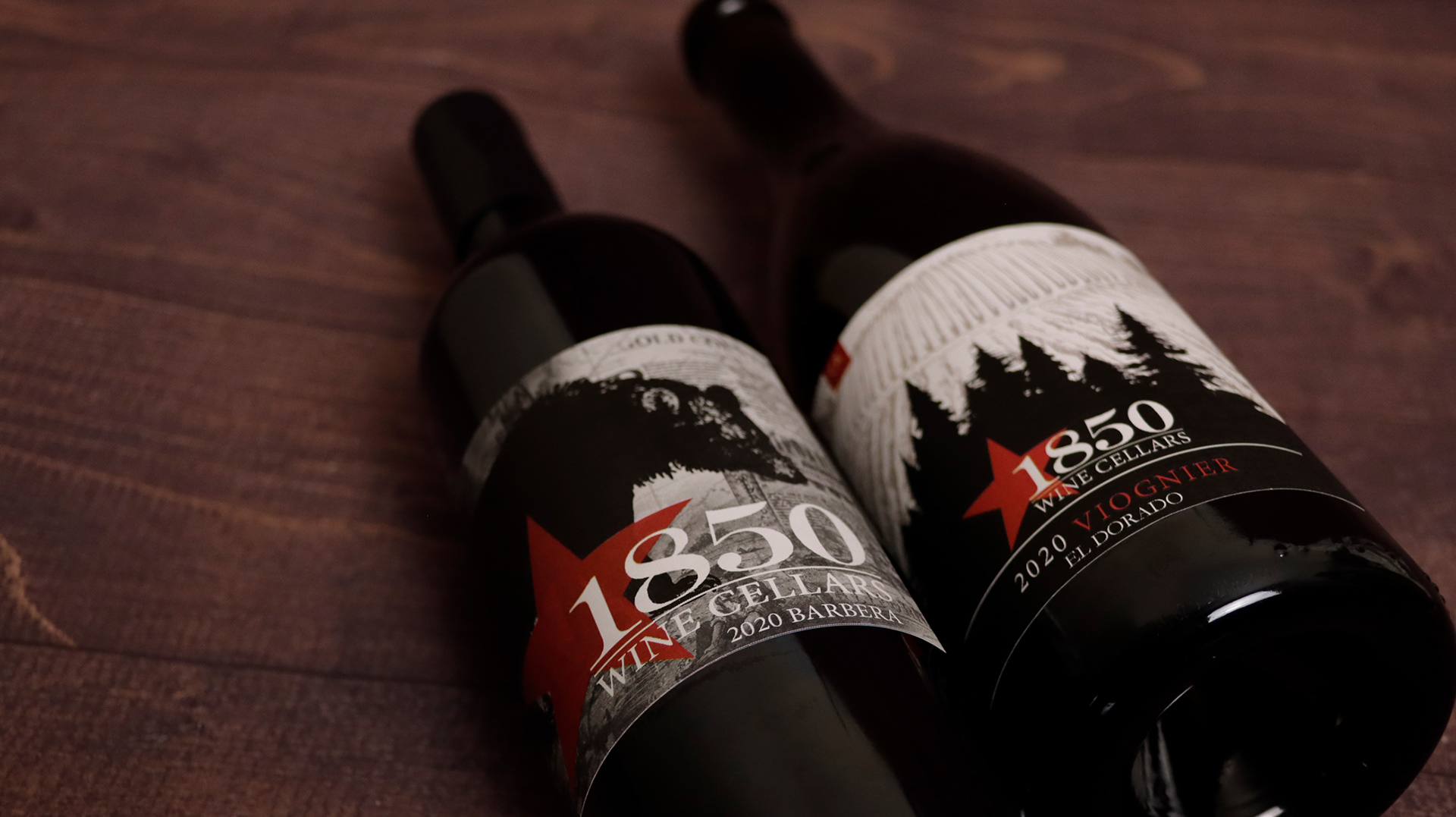 Two bottles of wine laying down