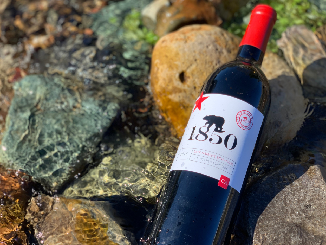 Bottle of wine on rock in water
