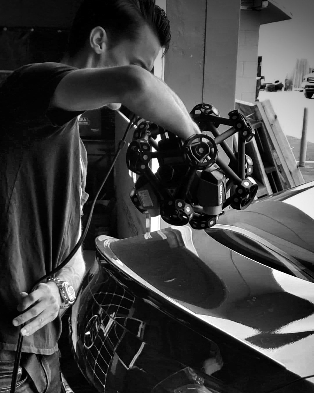 3D laser-scanning the trunk of the C63S AMG with a Creaform Metrascan 750.