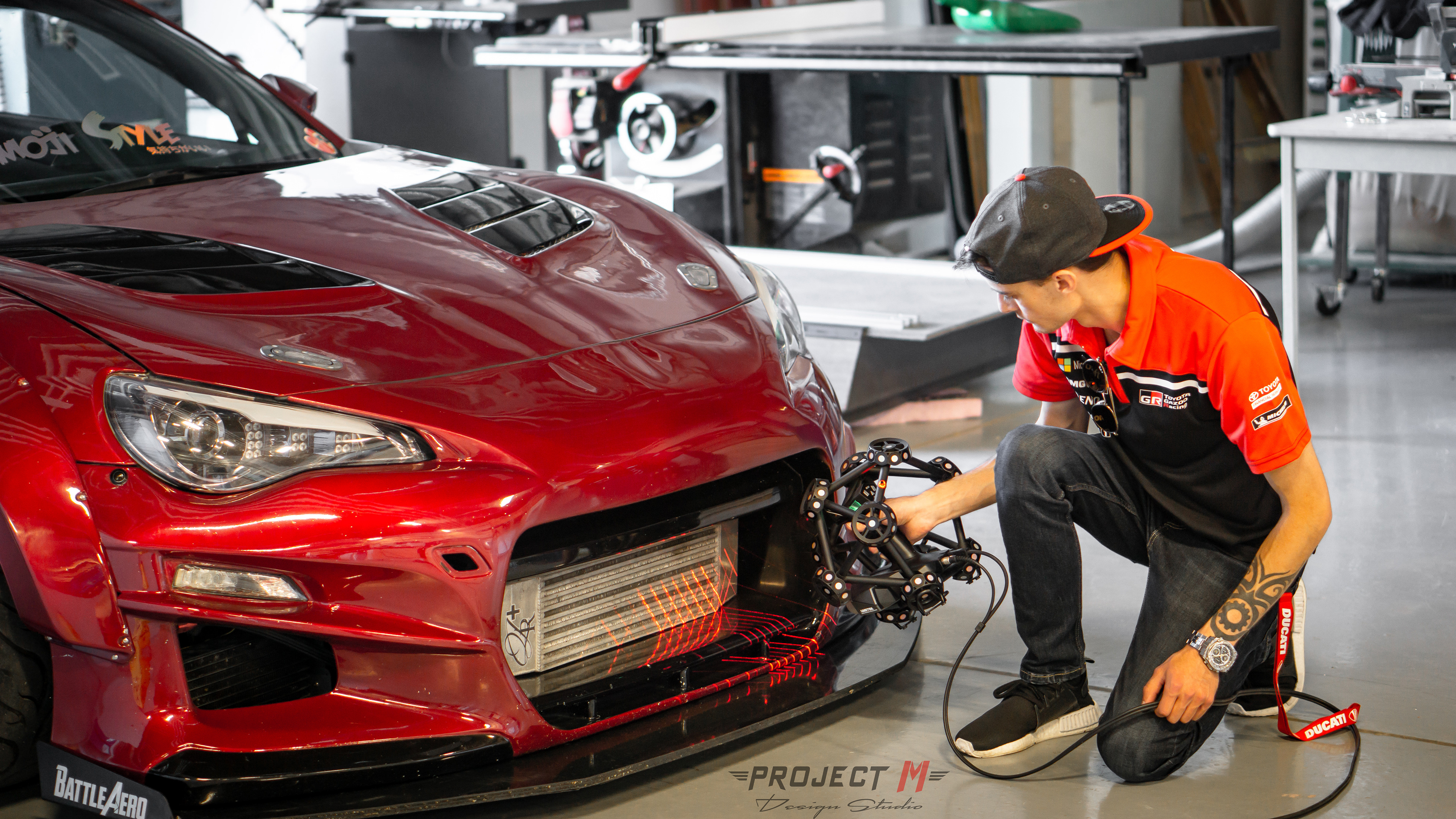 Laser scanning of the front end of the car with the Creaform Metrascan 750.