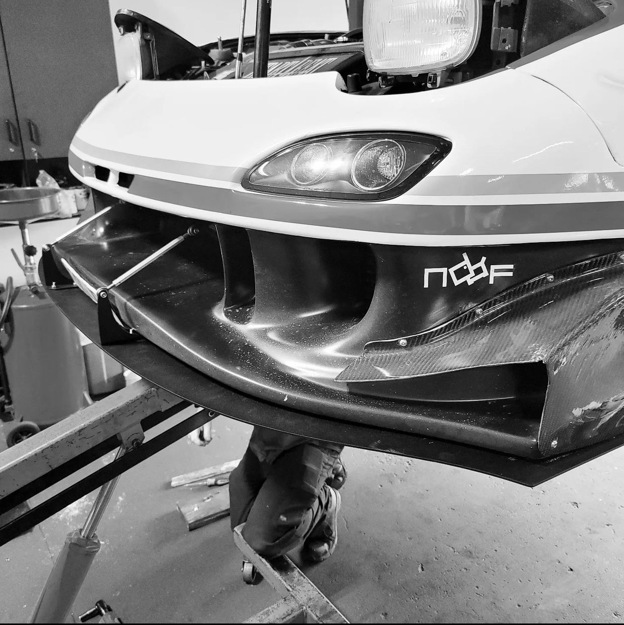 Installation of the chassis-mounted front splitter assembly.