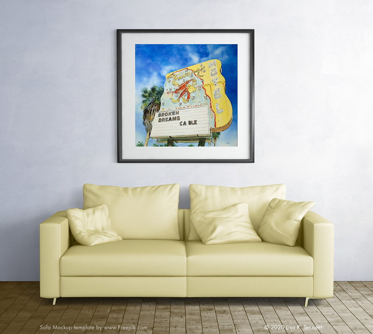 image of a sofa and the sandman motel painting in a frame above it