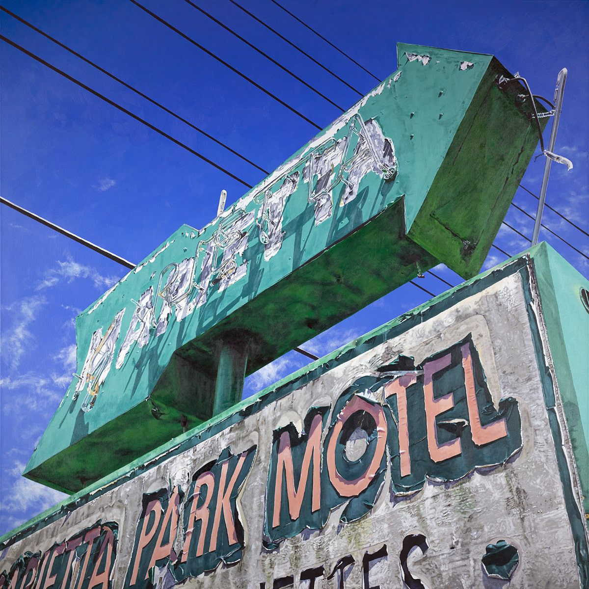 image of a motel sign in the shape of an arrow.