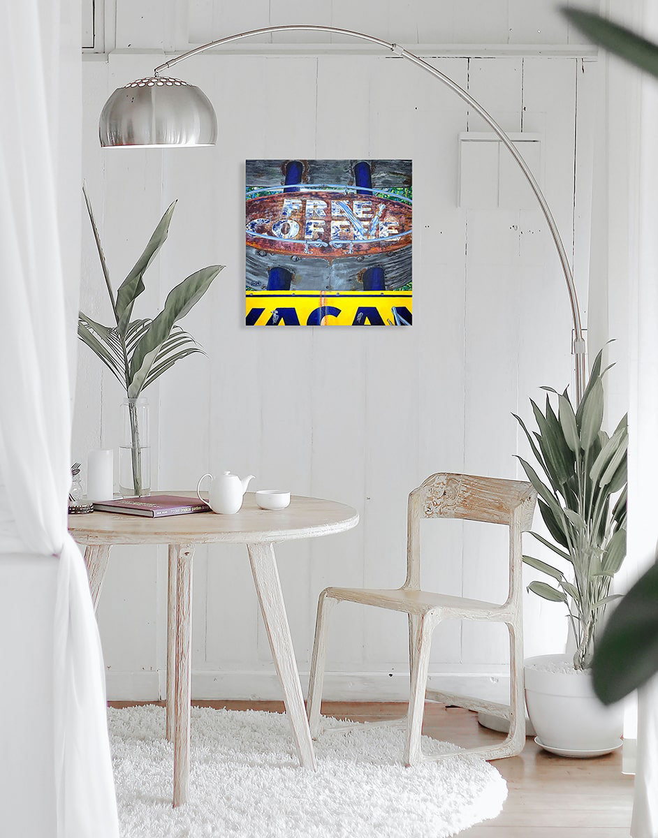 image of the painting on a wall above a table and chair