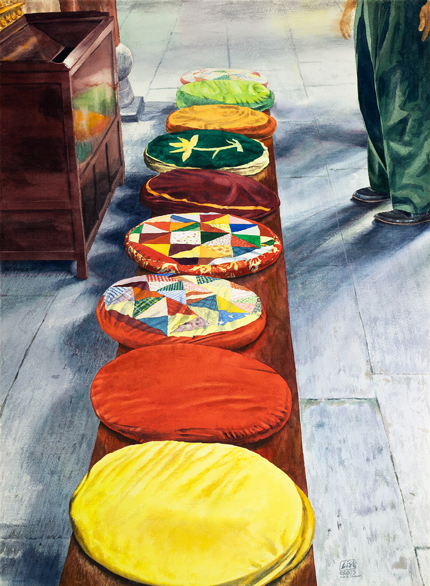 image of a set of cushions on a bench just before a person kneels down on it
