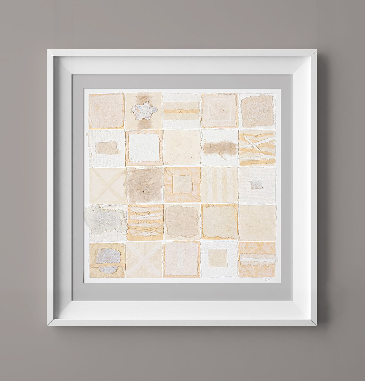 image of the collage in a box frame on the wall