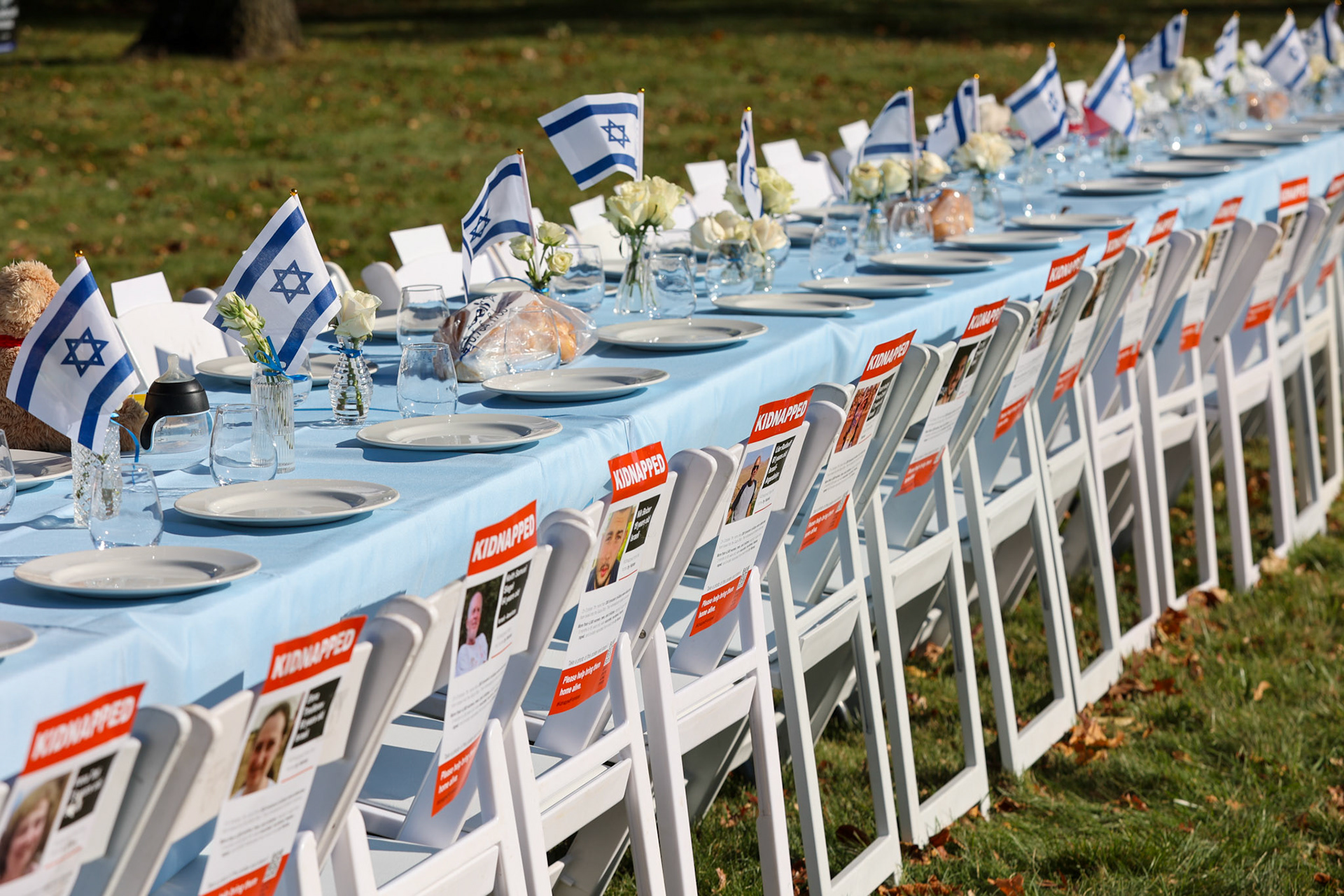 November 2023 - Har Sinai Oheb Shalom, Baltimore City. An art exhibition showing how many hostages are missing around Shabbat tables.