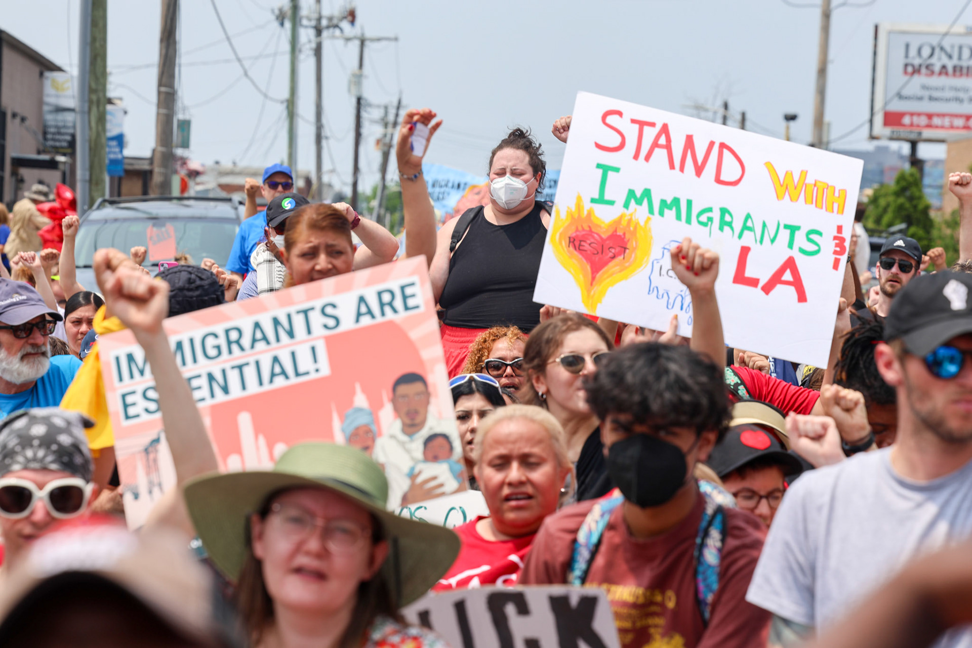 June 11, 2025, Highlandtown, Baltimore City, Maryland, USA. Hundreds gather to rally and march against ICE in Baltimore.  The group stopped at two local sites where immigrants have been arrested in recent days. Immigrant families were seen in their doorways and windows as marchers passed by.  Photo credit: Robyn Stevens Brody Sipa USA.
