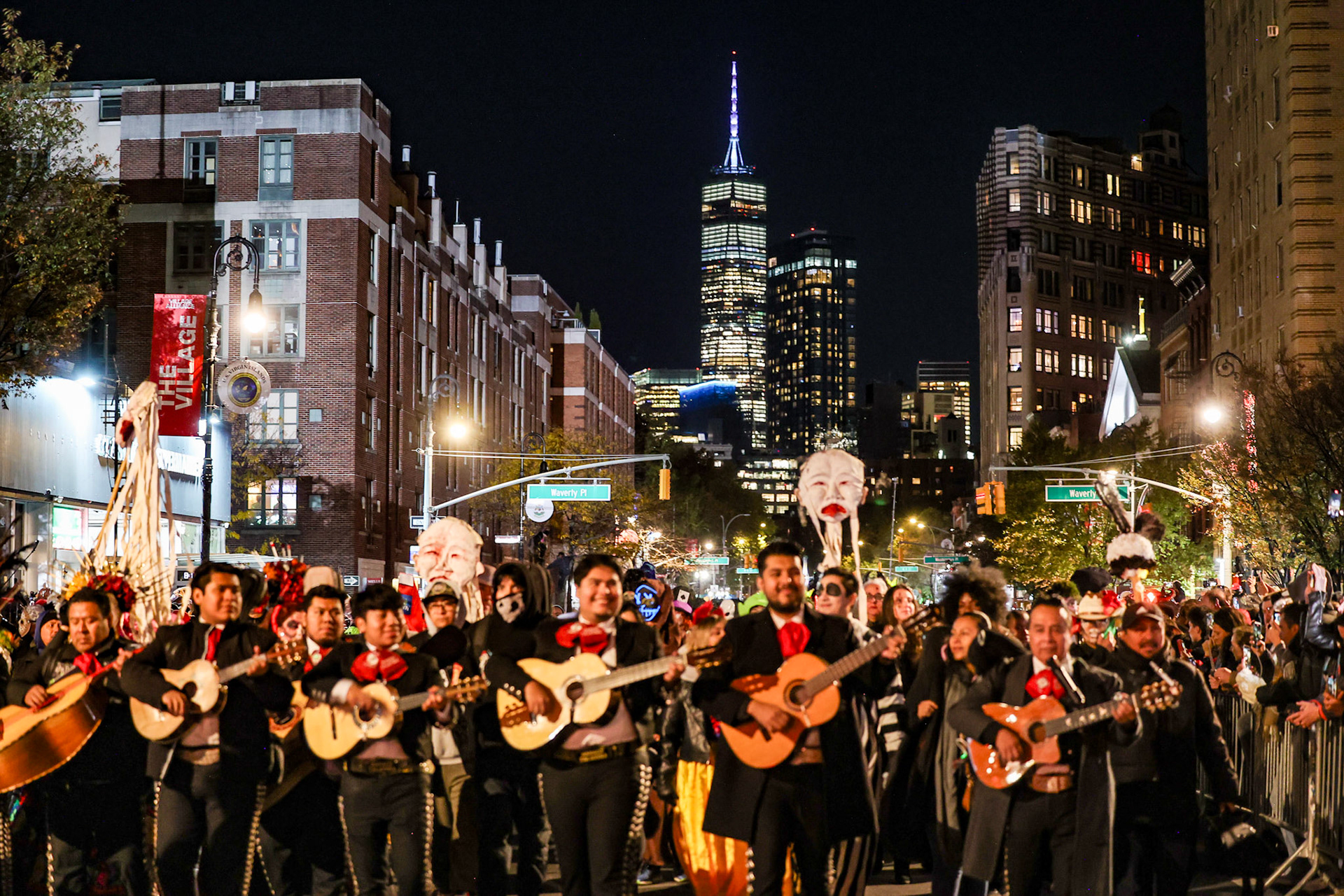 October 31, 2025, The Village, New York, USA. Revelers in elaborate costumes fill Sixth Avenue during the 2025 Village Halloween Parade in New York City celebrating the annual tradition with music, masks, and street performances. Photo Credit: Robyn Stevens Brody/Sipa USA.