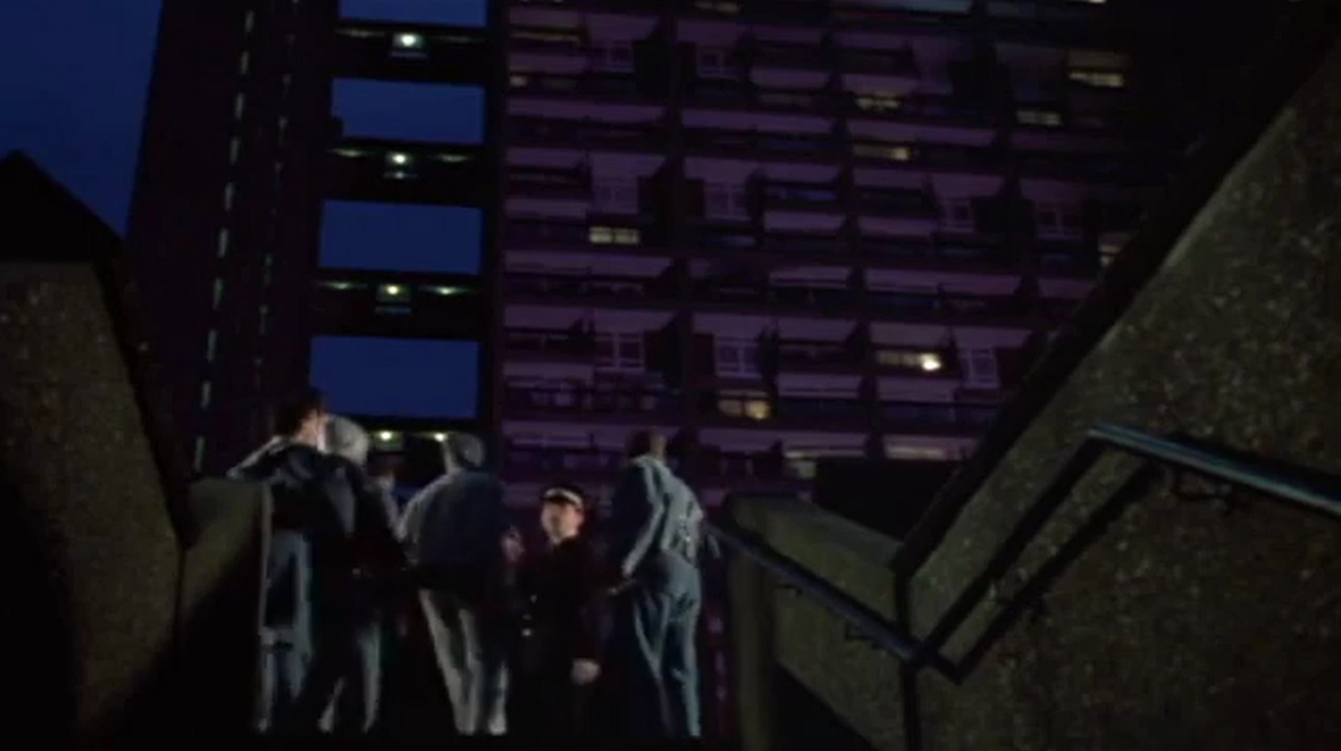 Still from 'Queen & Country', showing an iconic view of an iconic building. This view of the walkway is seen in many music videos and photoshoots