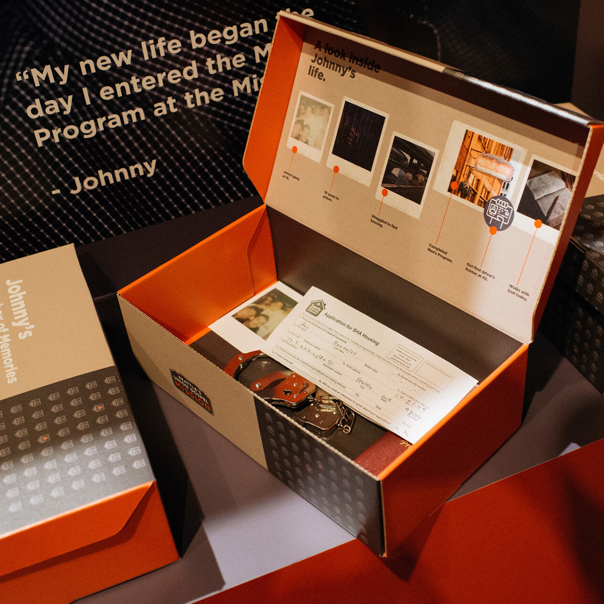 One of the interactive features, a shoe box full of objects representing different stages in the SUGM Alumnus's life.