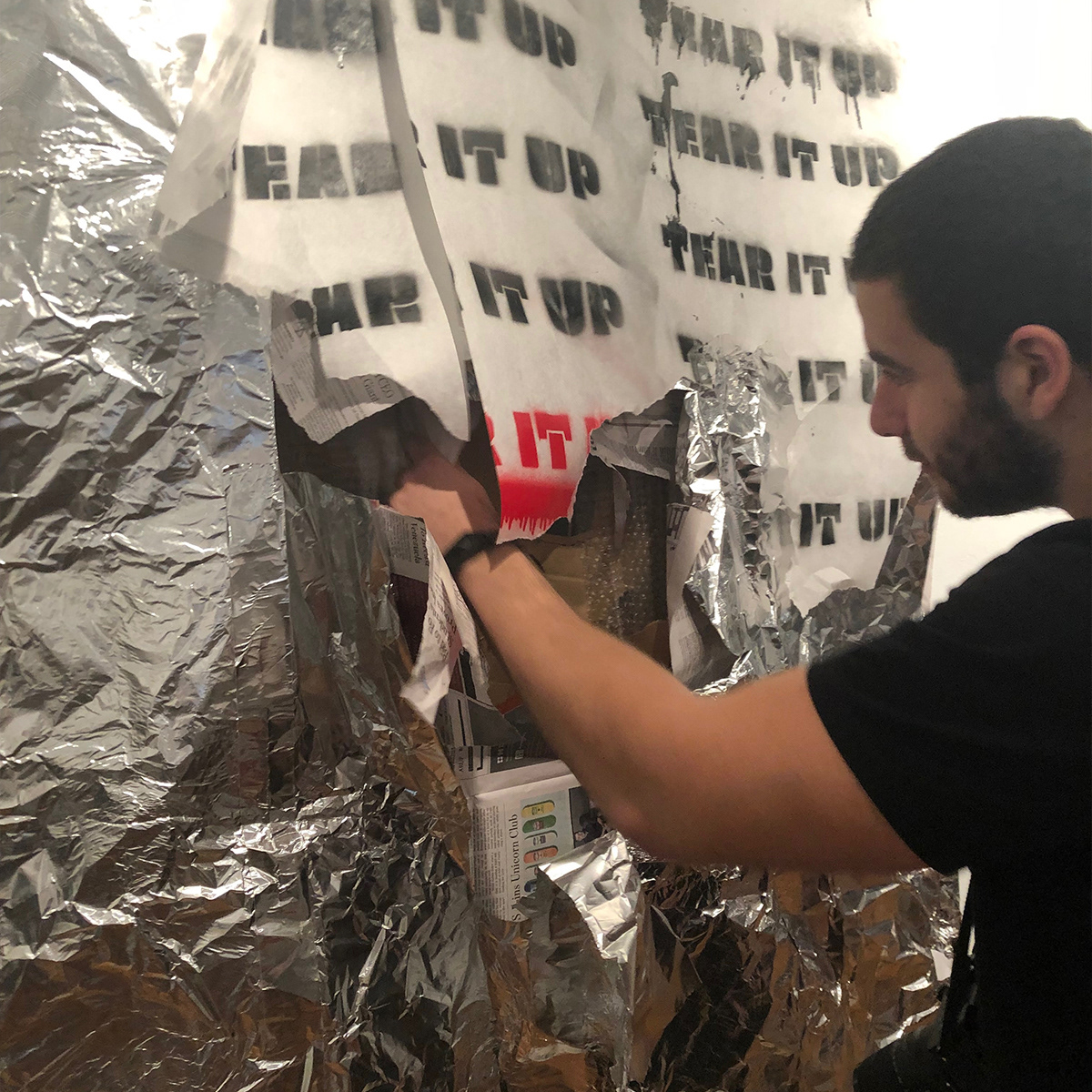 A BU student and campus journalist engaging with the installation.