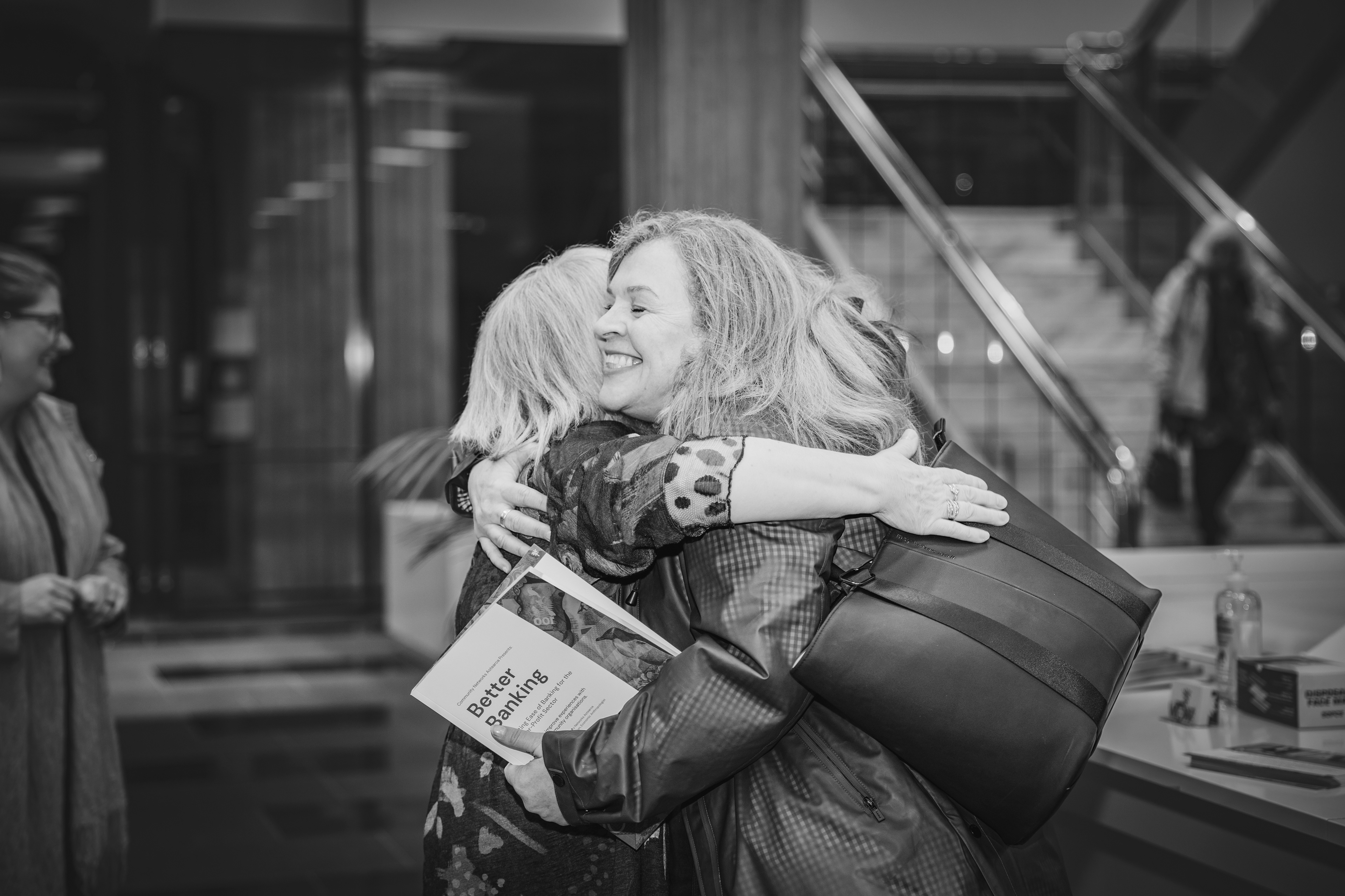 CNA Executive Officer Ros Rice hugs an attendee