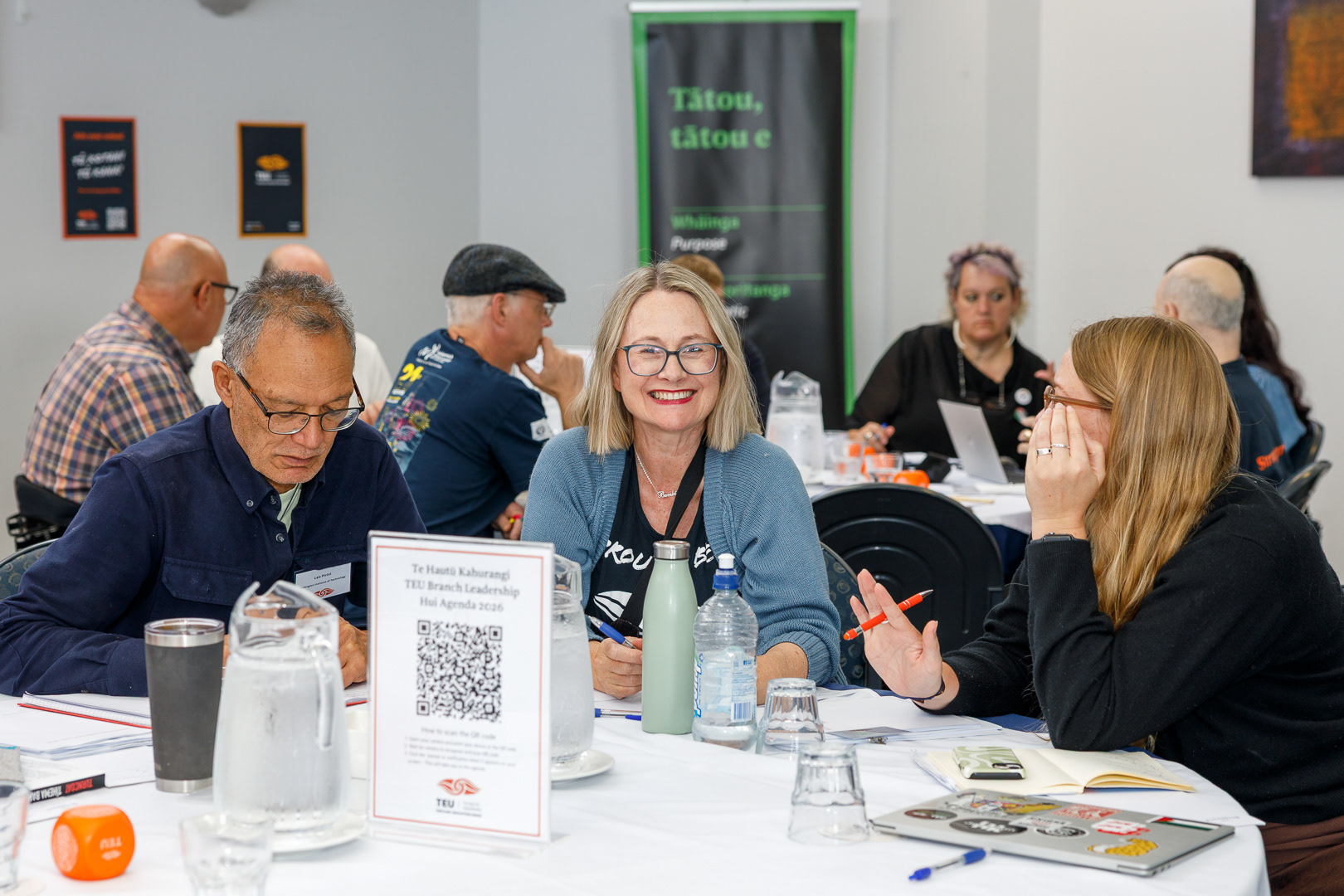 TEU Branch Leadership Hui attendees smile and collaborate.