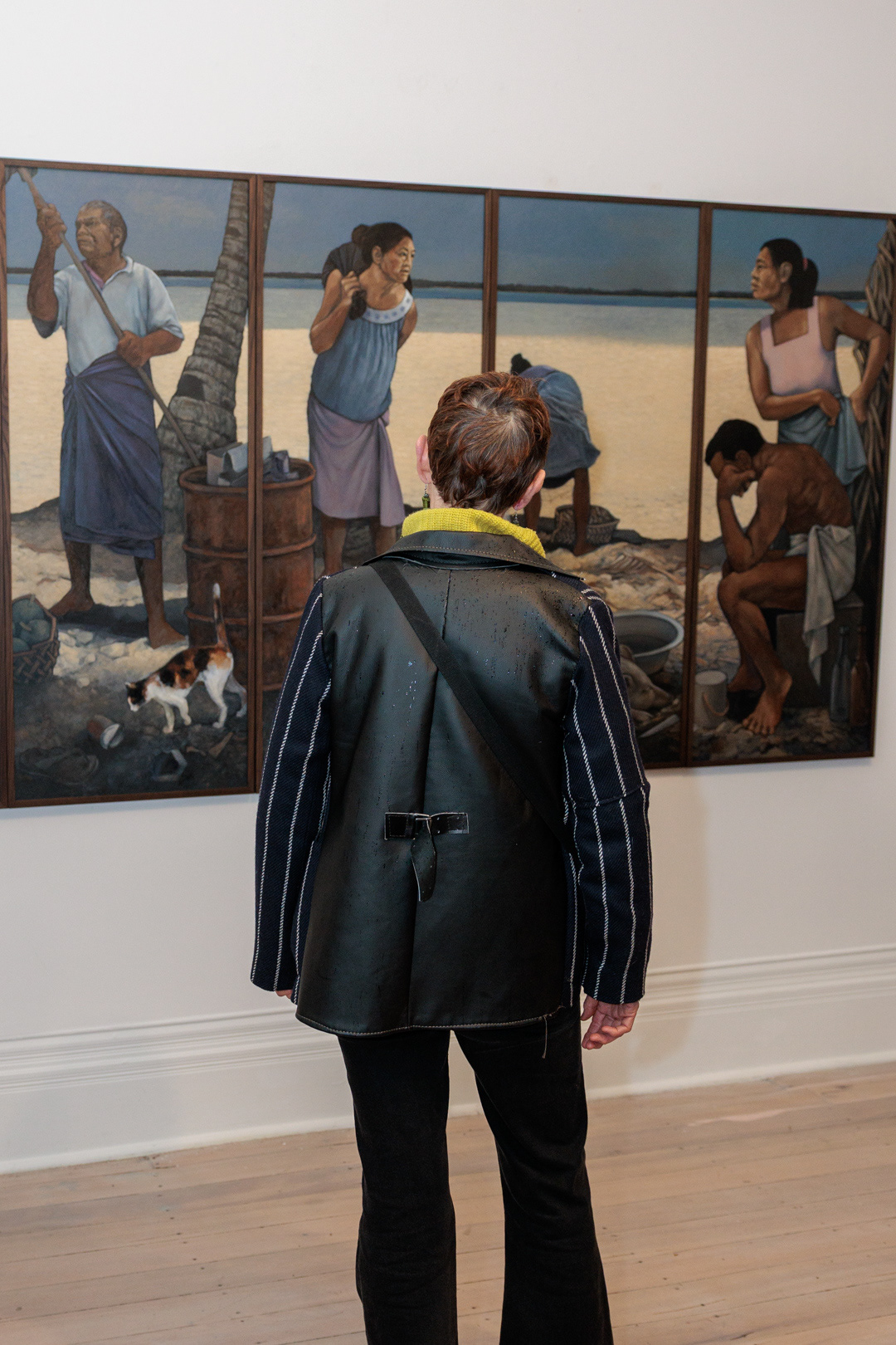 An attendee viewing Dame Robyn White's artwork at the gallery opening.
