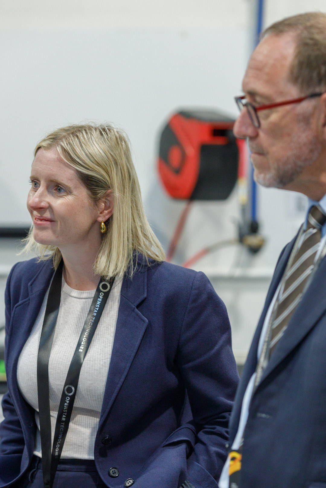 Mayor Andrew Little listens alongside members of parliament during a tour of the OpenStar facility.