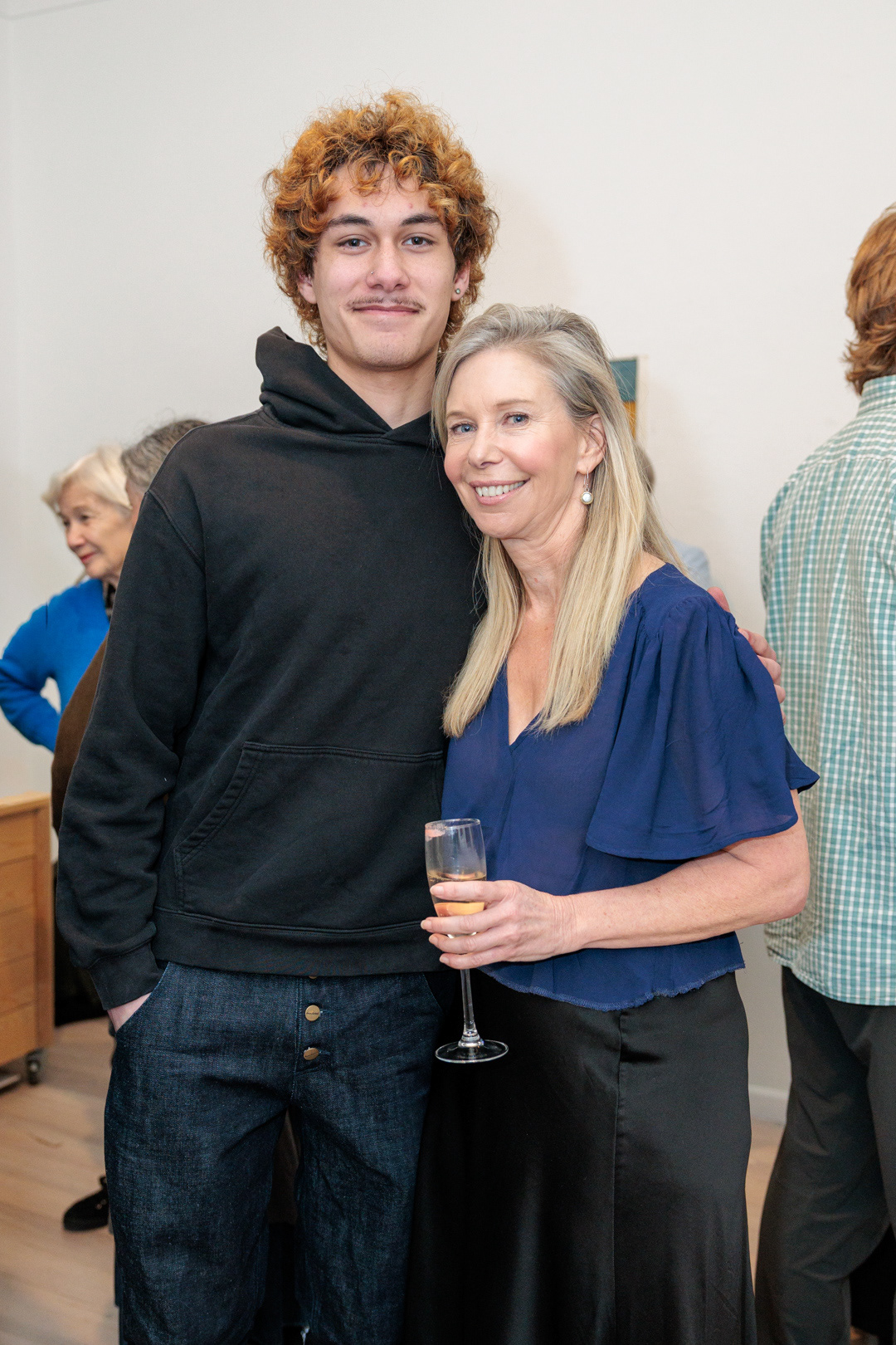 Olivia McLeavey and her nephew at the opening of Dame Robyn White's exhibition