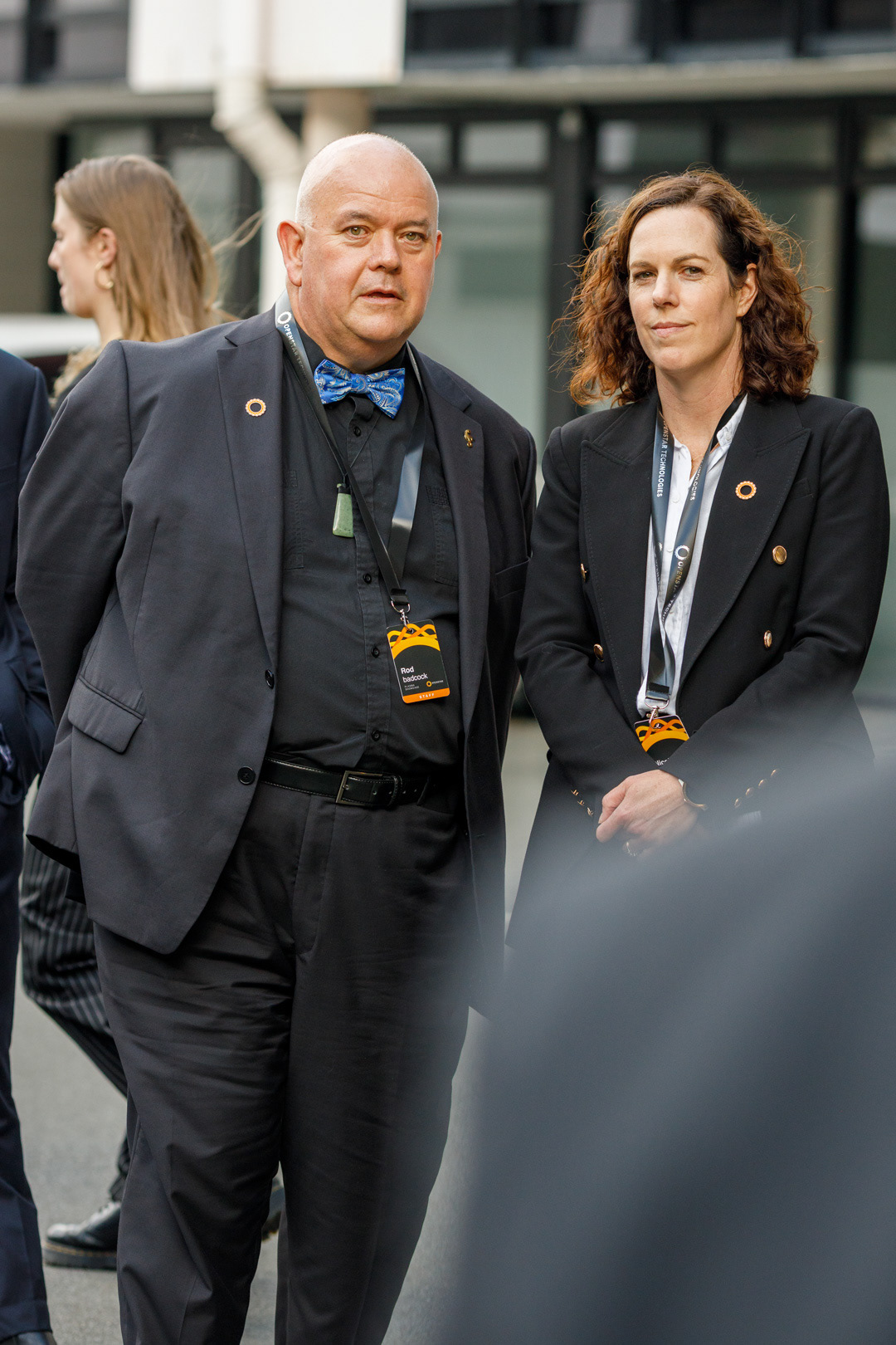 OpenStar's Chief Technology Officer, Rod Badcock, and VP of Finance, Nicole Ferguson stand together during speeches. 