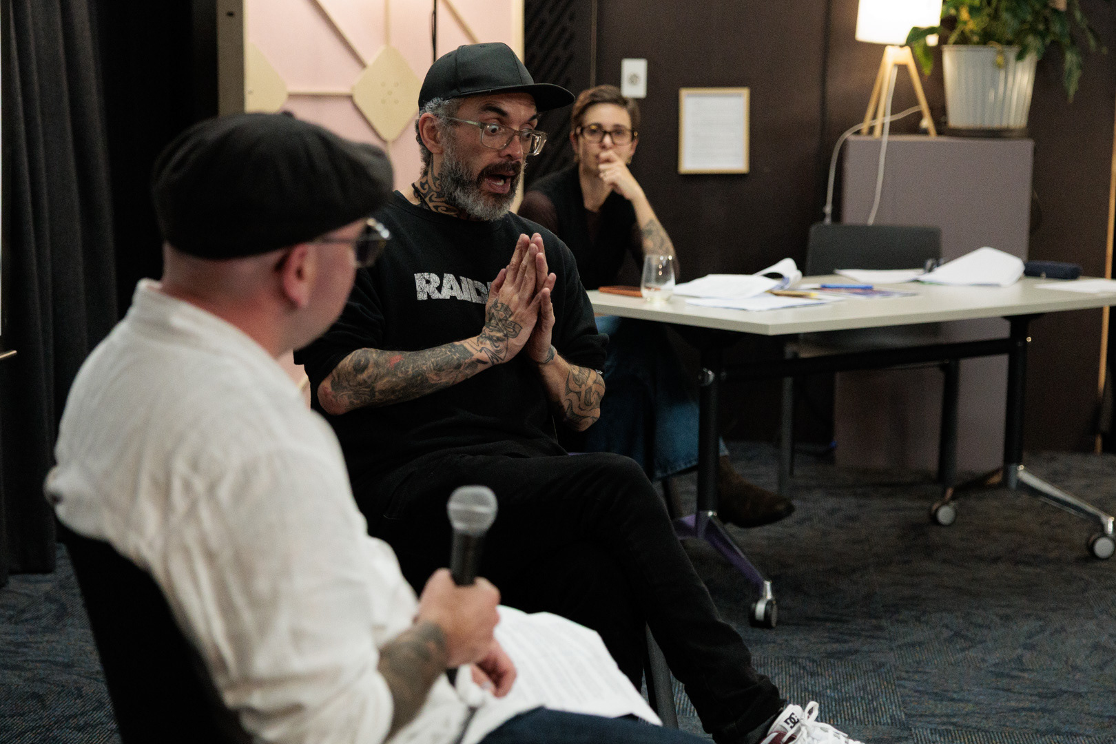 Jared Flitcroft speaks with Stace Robertson using NZSL at the Arts Access Aotearoa AGM 2026