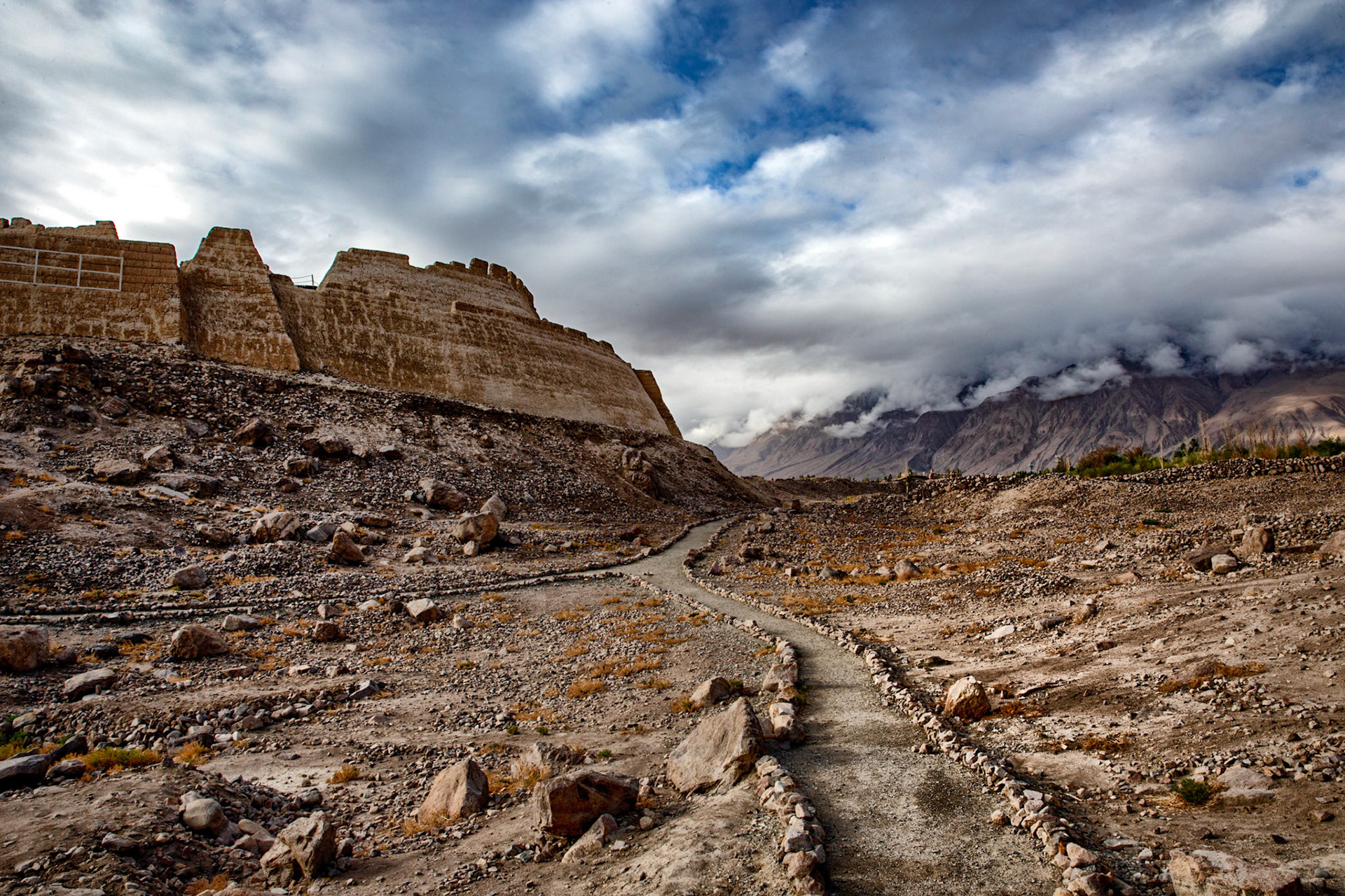 Tashgurkan, China - September 6, 2018 :group of people standing around a campfire China , stone fortress.
