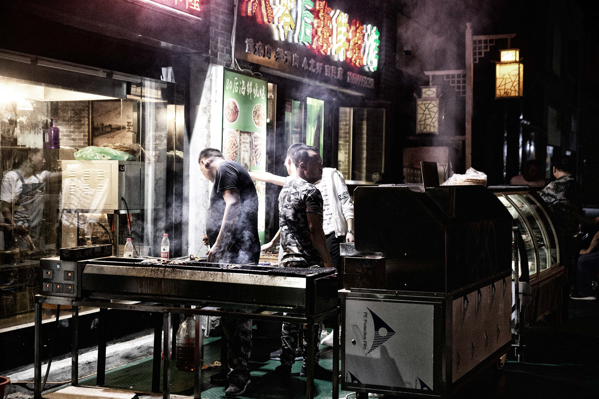 Shanshan, Xinjiang, China - september 2, 2018: Street food, kebab, being grilled at the oasis of Shanshan