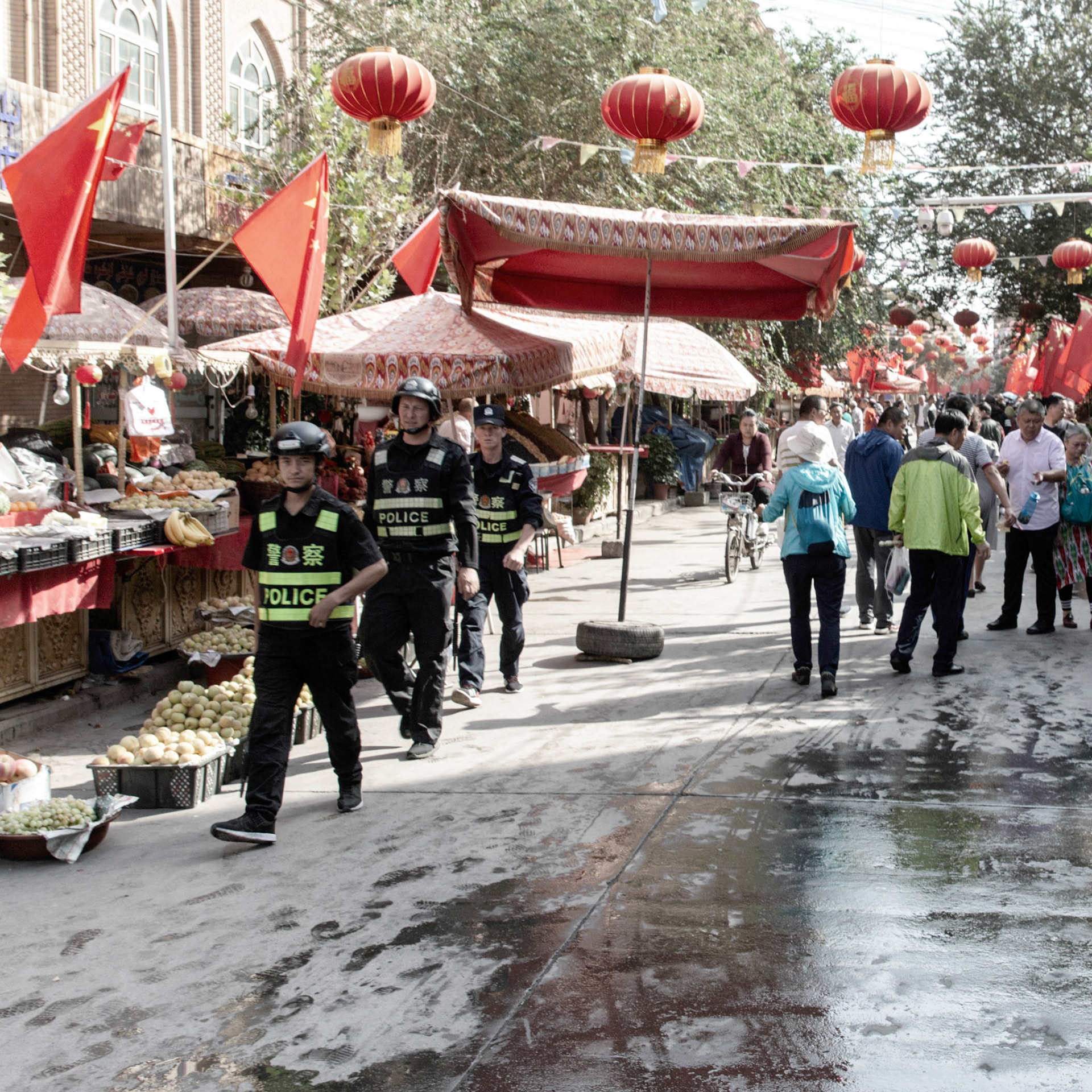 Kashgar,  China - September 11th, 2018 : Police patrolling the Kashgar food market.