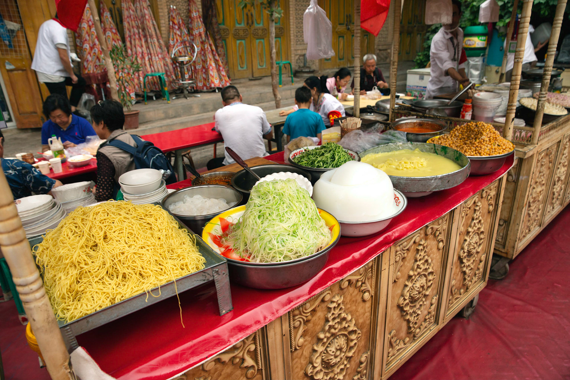 kashgar, Xinjiang, China - September 5, 2018: Food stall Kasghar food market, famous cold noodle dishes