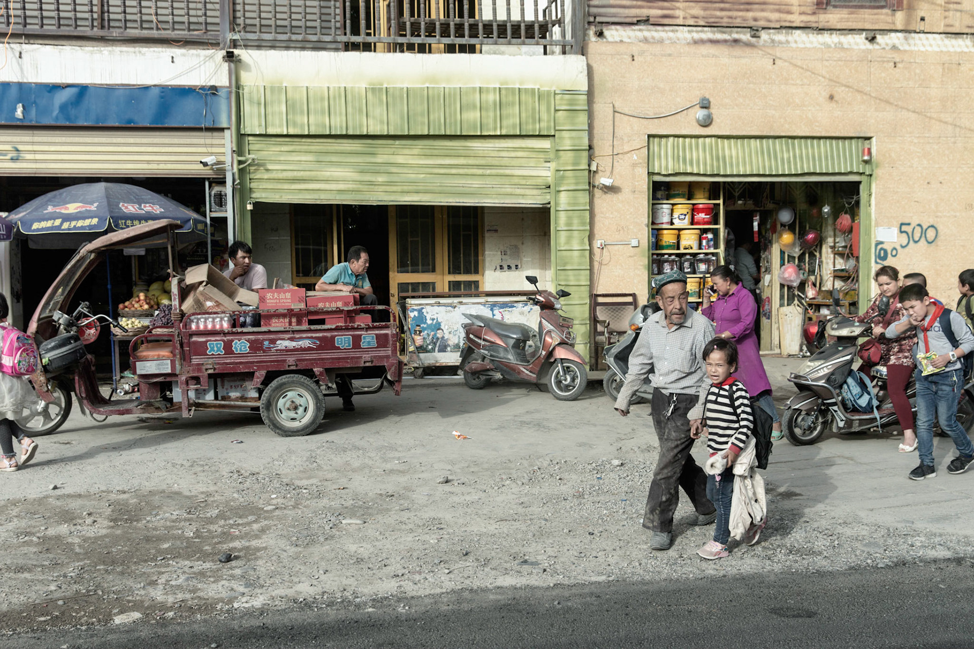 Kargilik, China - september 12th 2018: Preparing a rice and fruit meal in a small restaurant